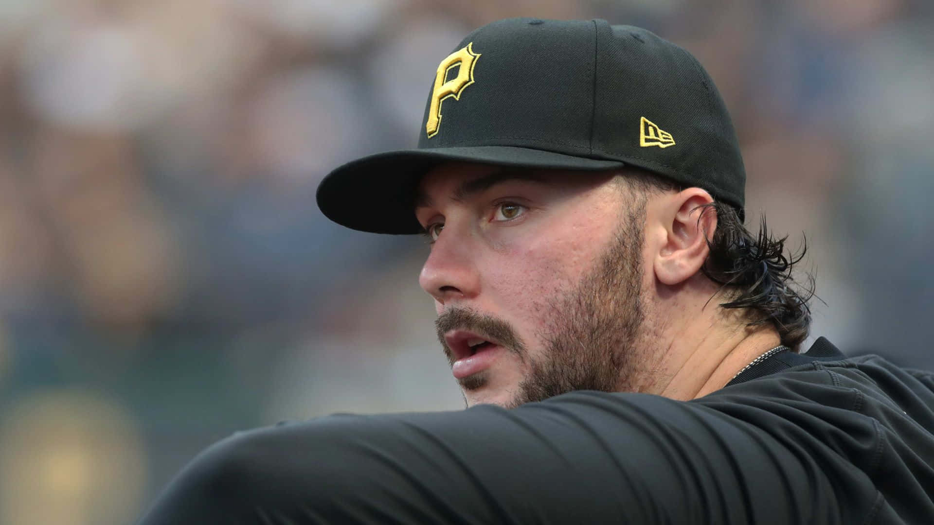 Paul Skenes, black cap, yellow 'P' logo, Full HD Desktop Wallpaper