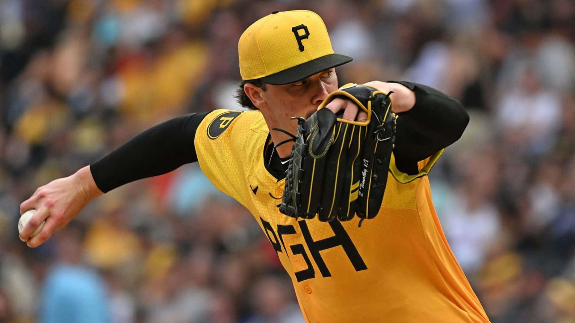 Paul Skenes, yellow and black uniform, mid-throw, Full HD Desktop Wallpaper
