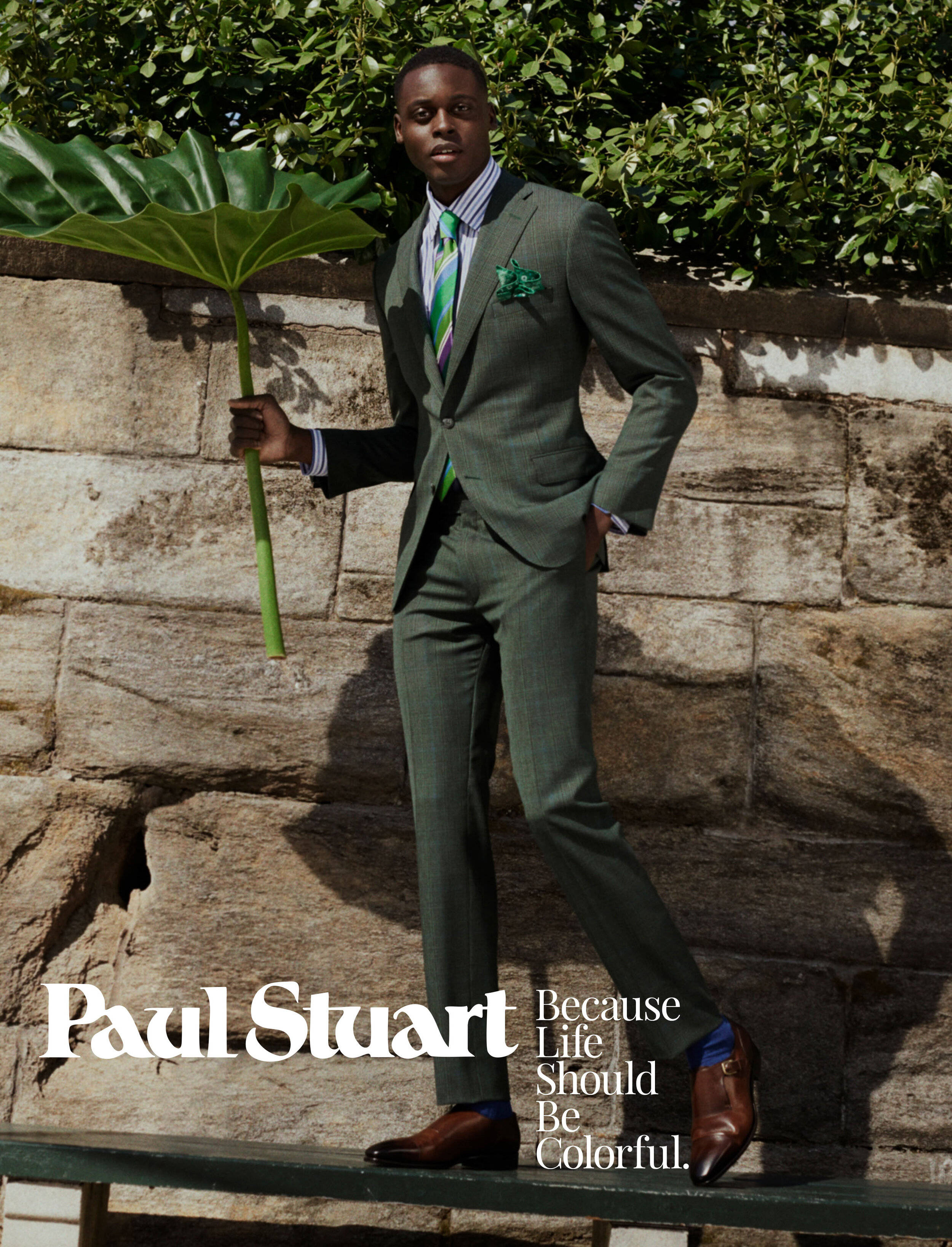 Paul Stuart, green suit, stone wall, 2K Phone Wallpaper