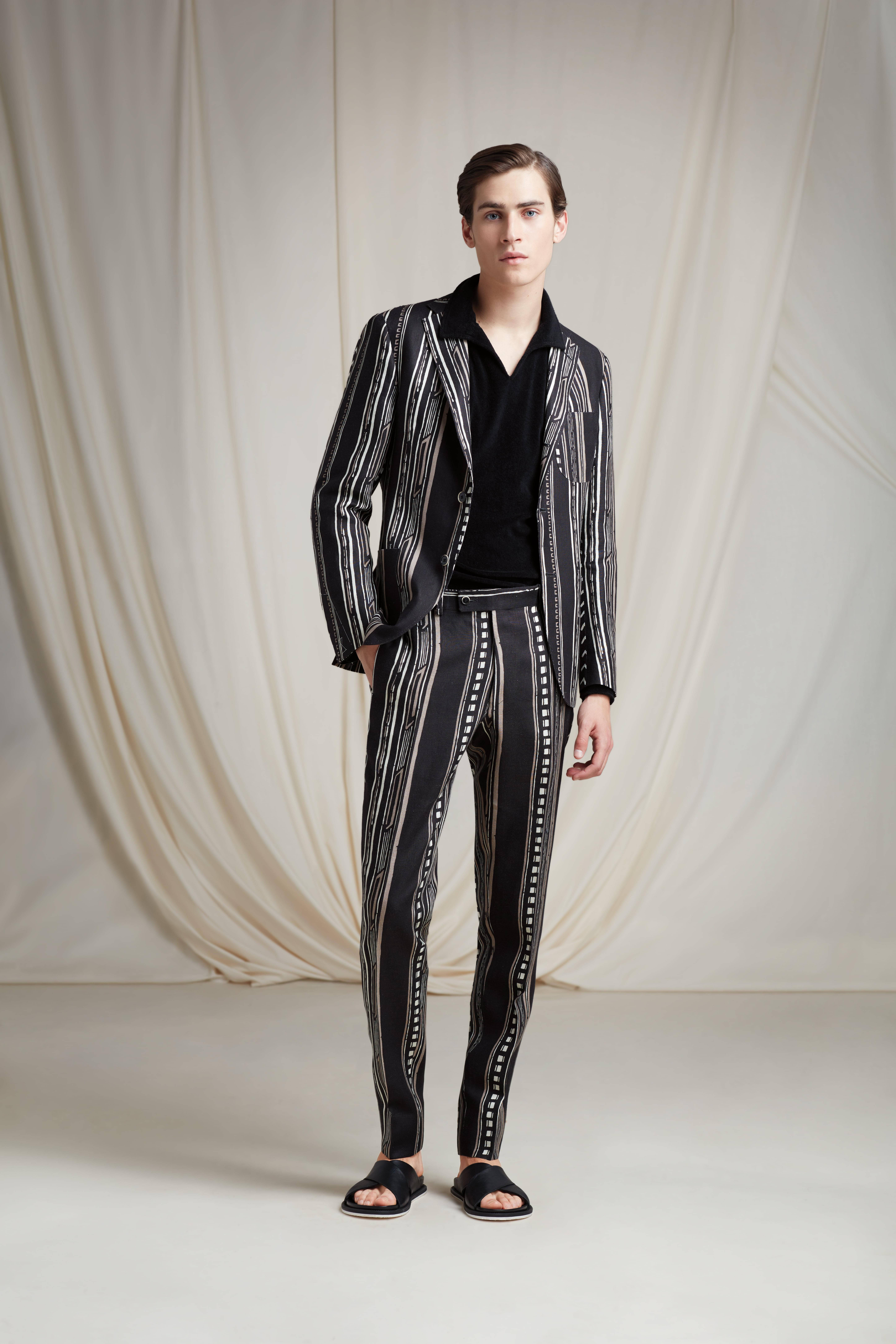 Paul Stuart, black and white striped suit, creamy backdrop, 8K Phone Wallpaper