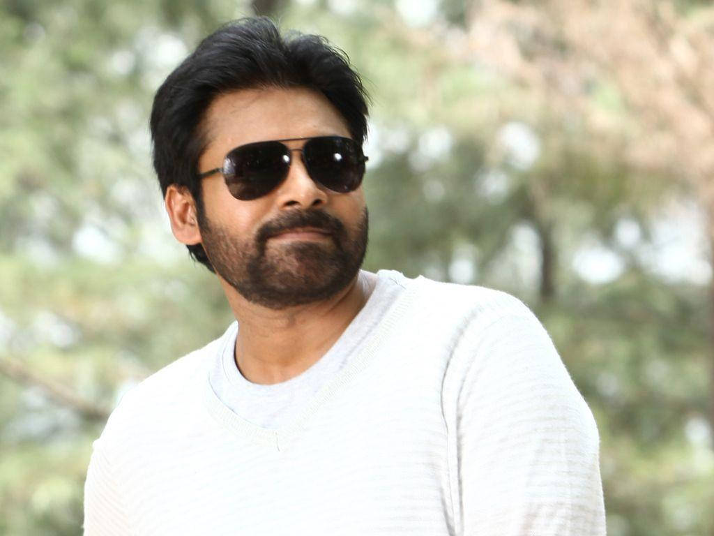 Pawan Kalyan, white sweater, blurred green tree background, SD Desktop Wallpaper