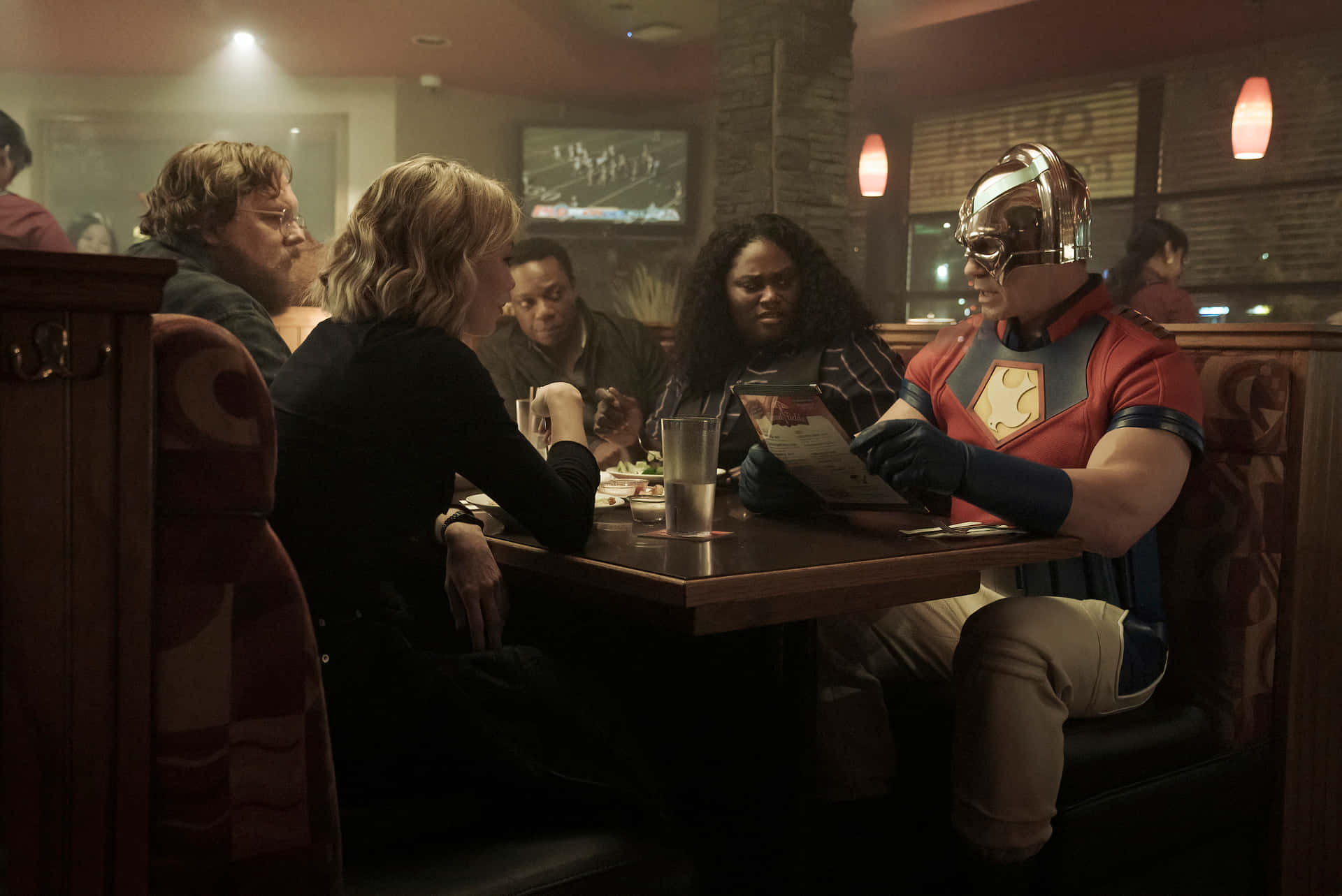 Peacemaker, red and blue costume, dimly lit restaurant booth, Full HD Desktop Wallpaper