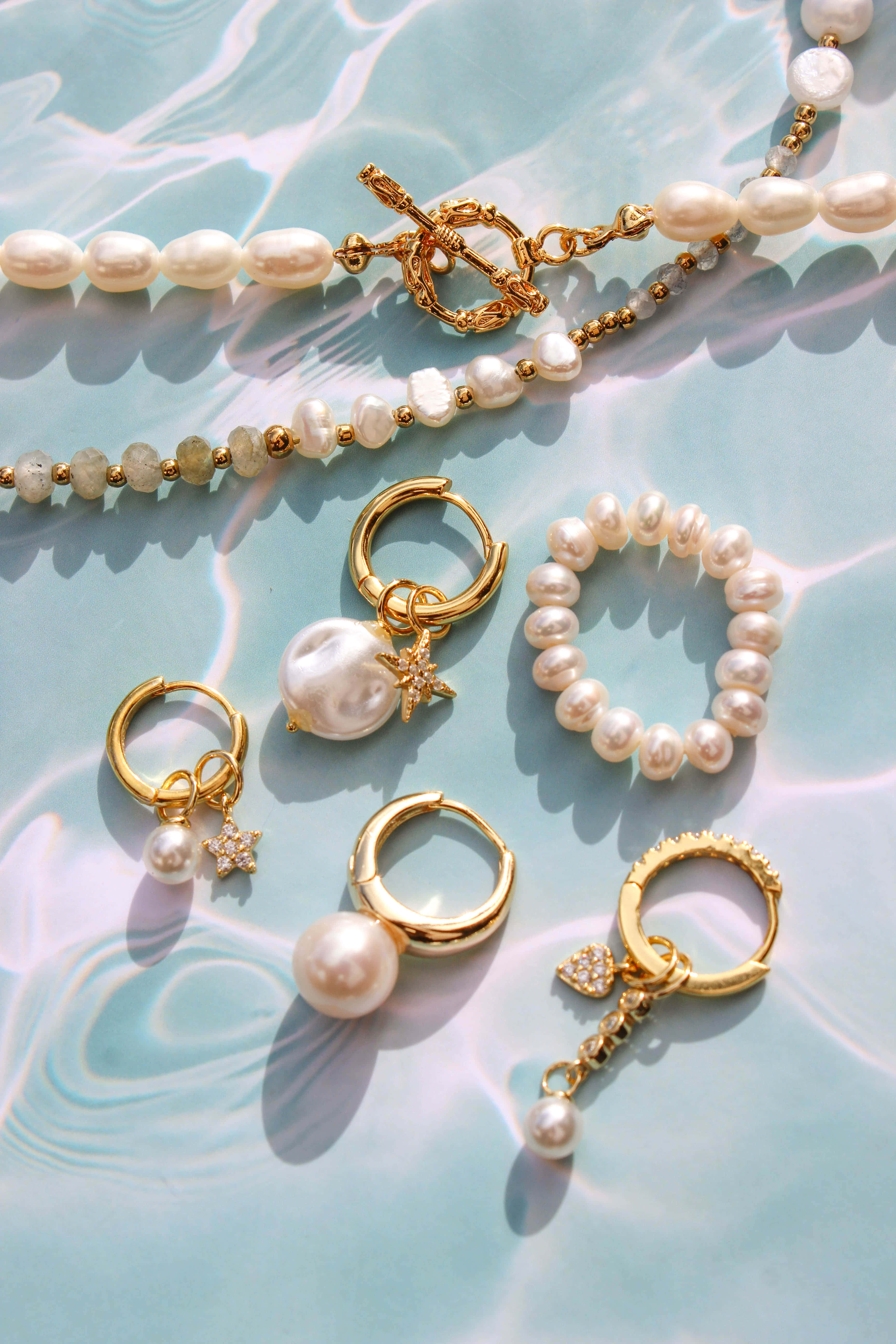 Elegant Pearl Jewelry Collection, golden pearl jewelry, rippling turquoise water, 5K Phone Wallpaper