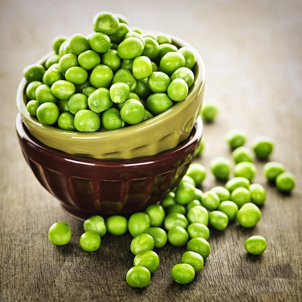 green peas, stacked ceramic bowls, rustic wooden surface, SD Desktop Wallpaper