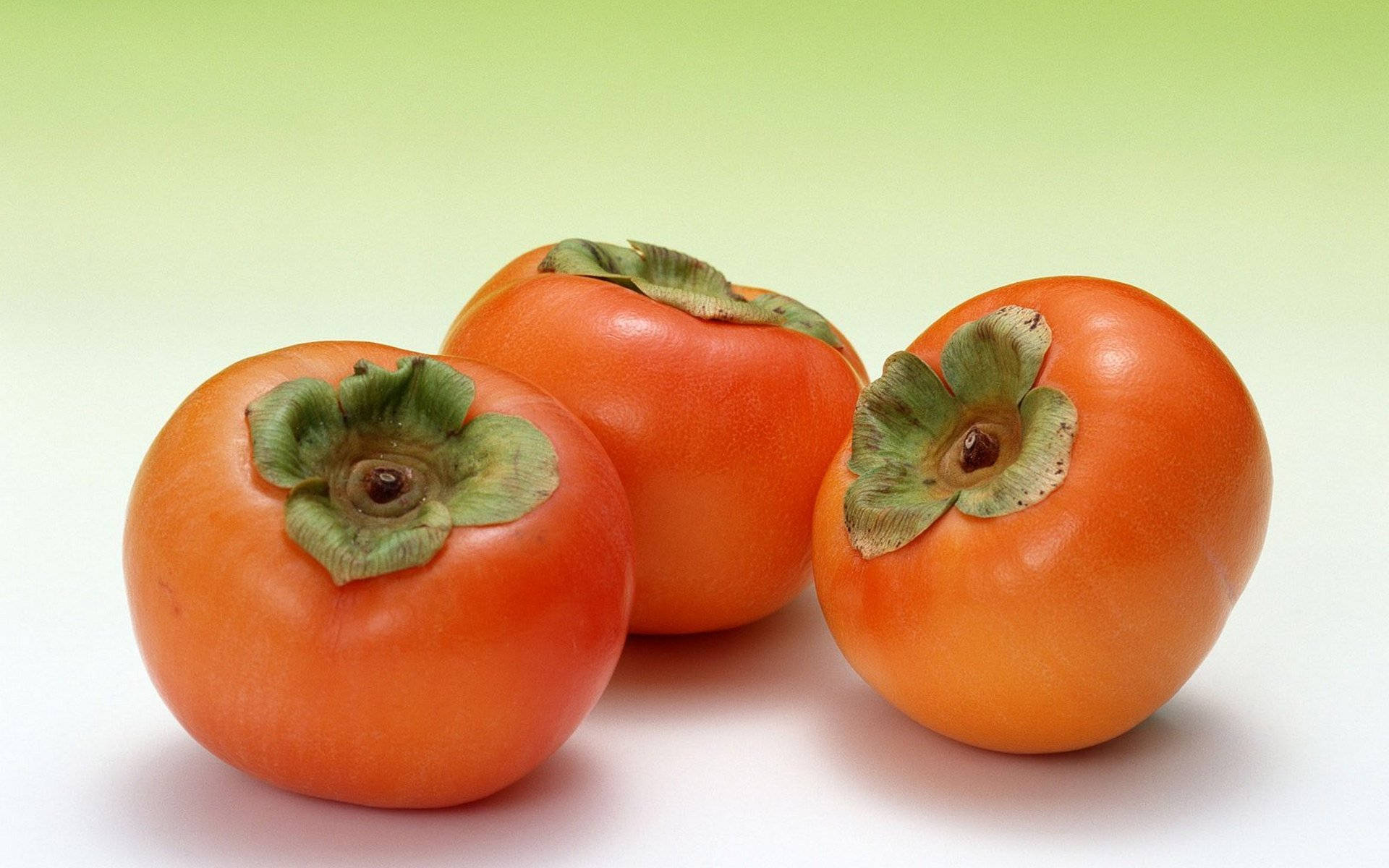 three persimmon fruit, ripe orange persimmons, green leafy caps, Full HD Desktop Wallpaper