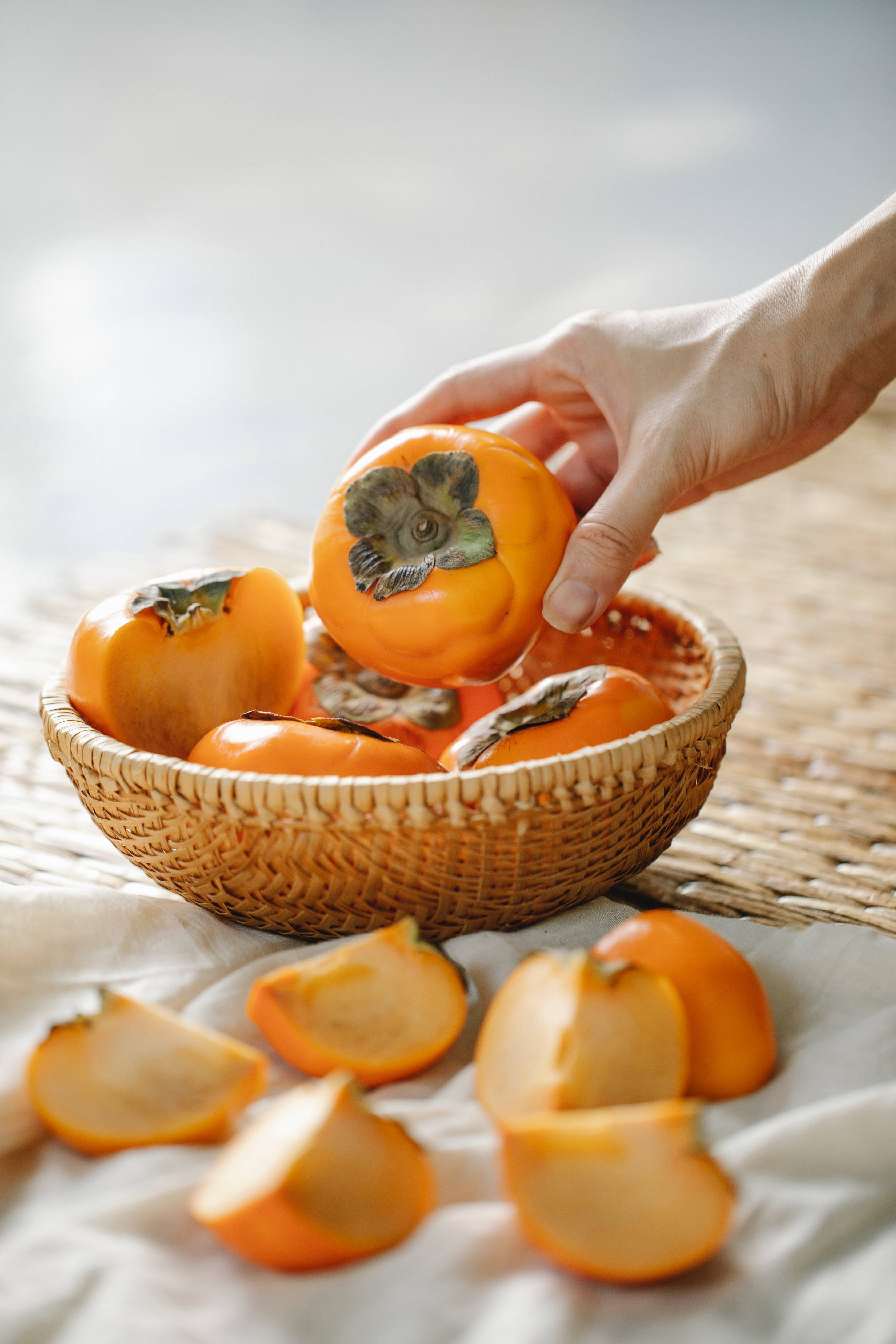 persimmon fruit, woven basket, vibrant orange fruit, 4K Phone Wallpaper