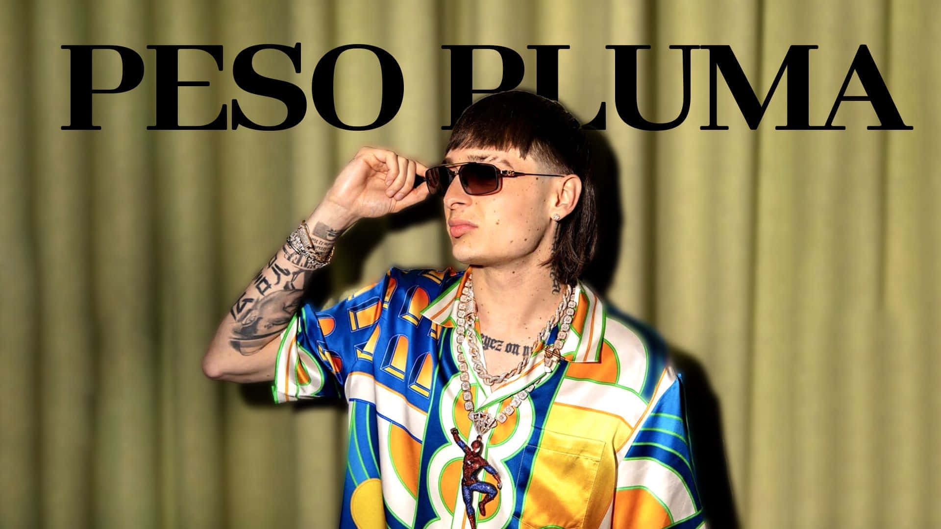 Peso Pluma, green curtain backdrop, vibrant geometric shirt, Full HD Desktop Wallpaper