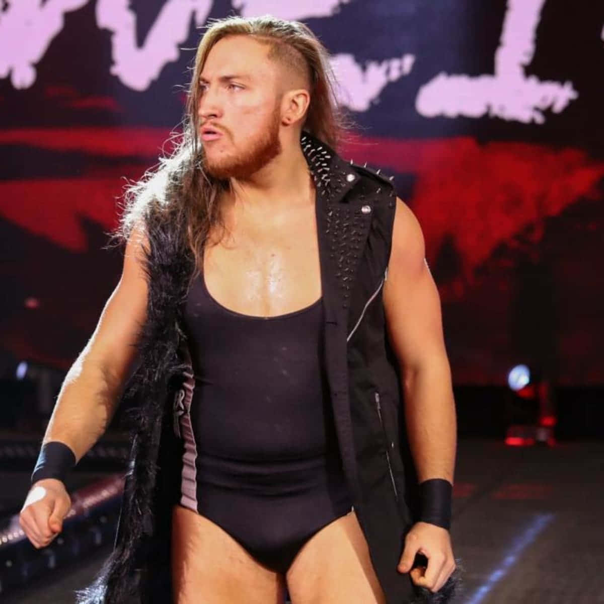 Pete Dunne, grimacing, black studded vest, SD Desktop Wallpaper