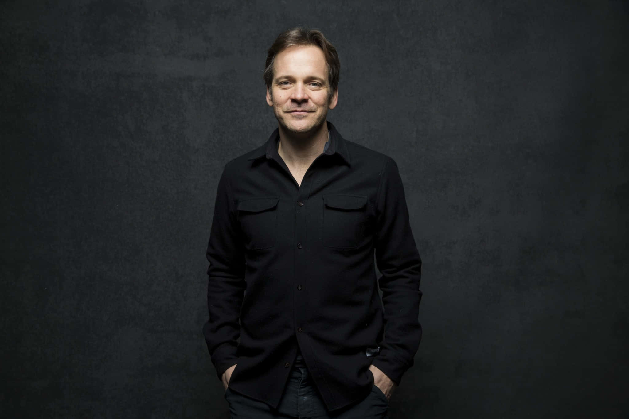 Peter Sarsgaard, black shirt, textured dark gray backdrop, Full HD Desktop Wallpaper