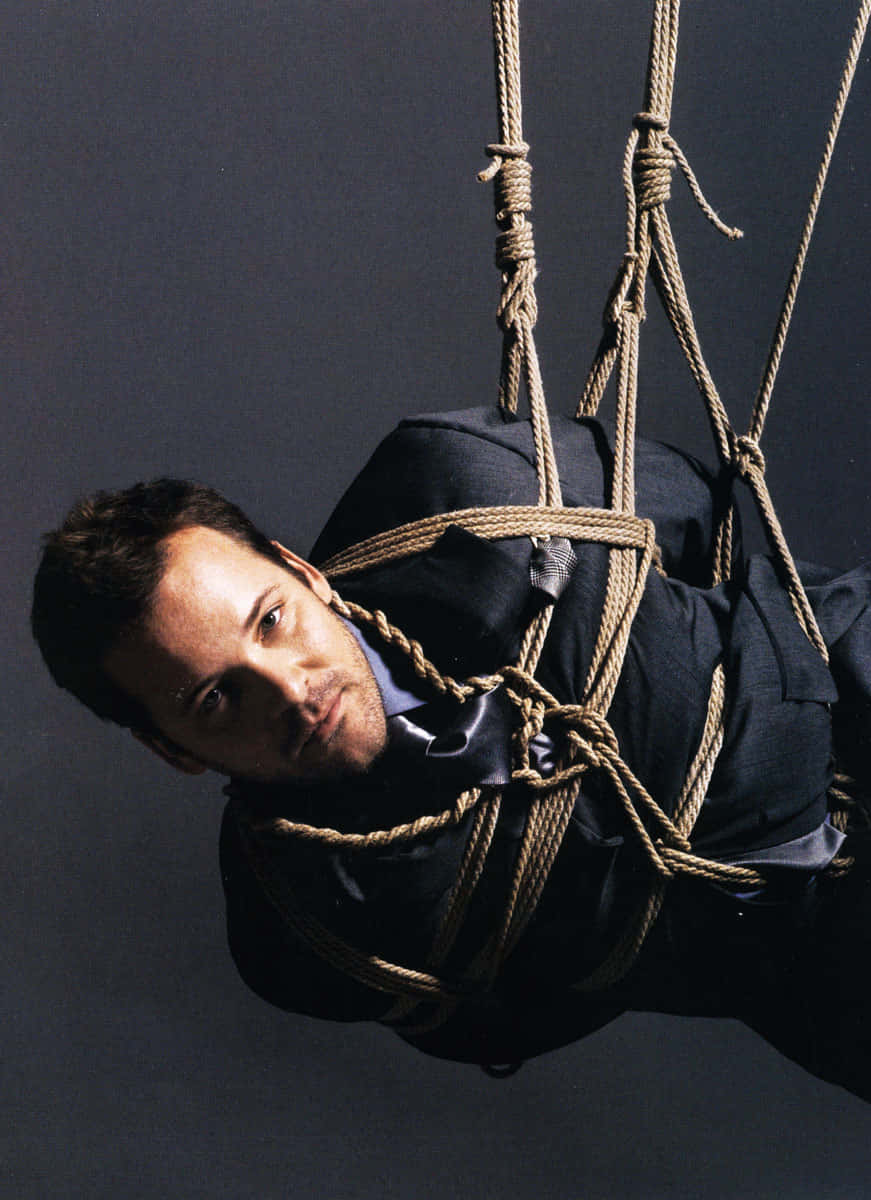 Peter Sarsgaard, dark suit, thick ropes, SD Phone Wallpaper