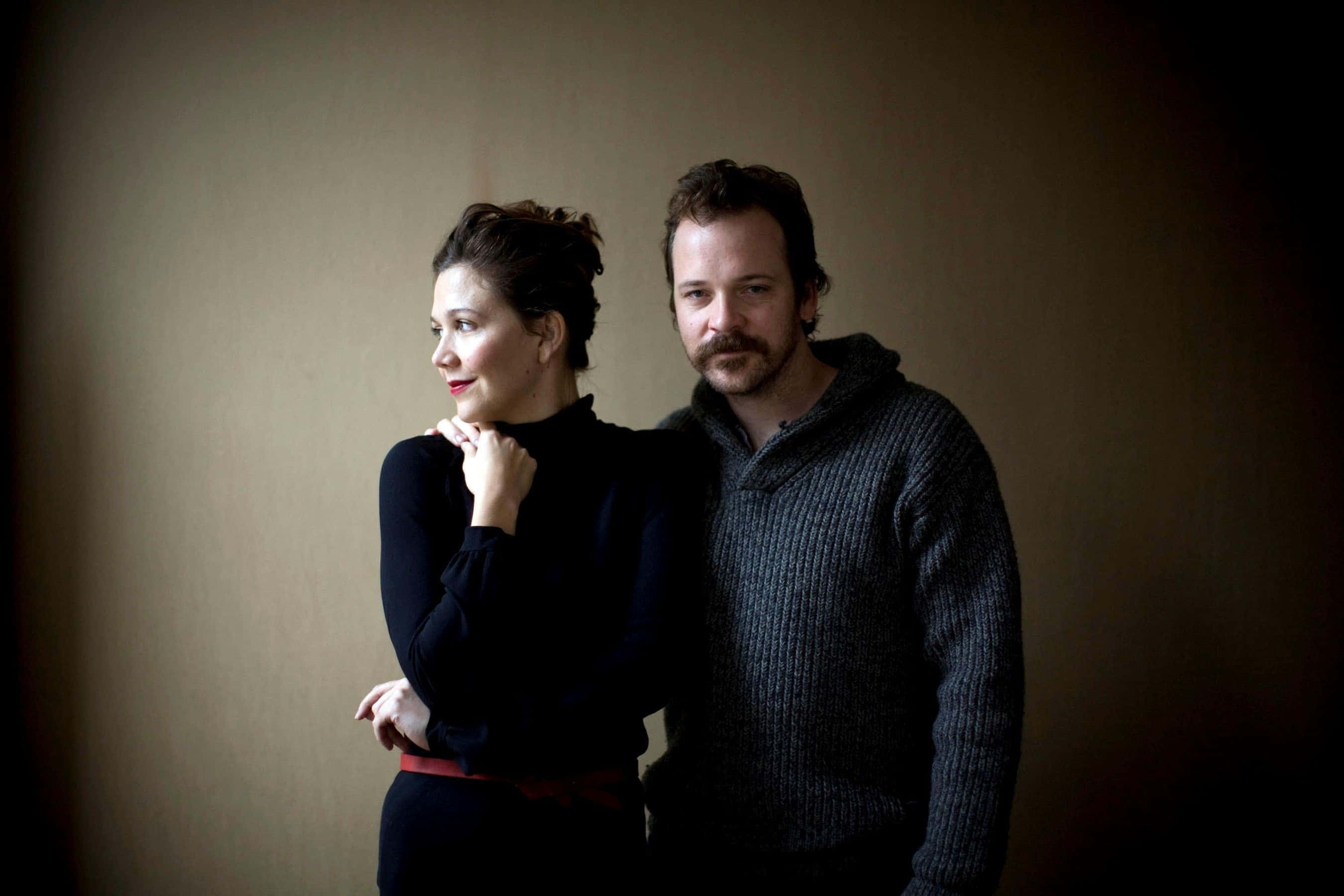 Peter Sarsgaard, dimly lit room, soft shadows, 2K Desktop Wallpaper