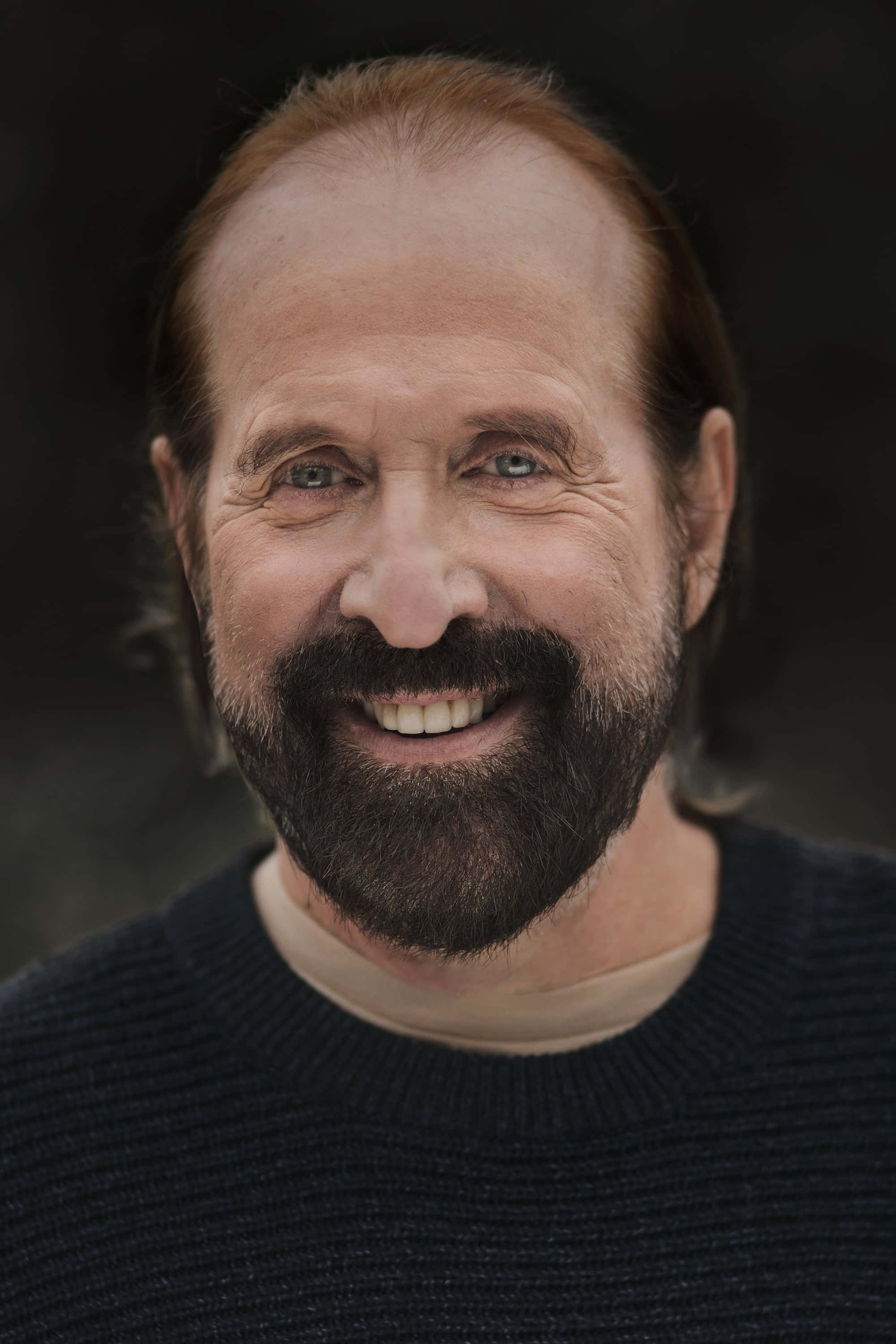 Peter Stormare, dark sweater, blurred natural background, 2K Phone Wallpaper