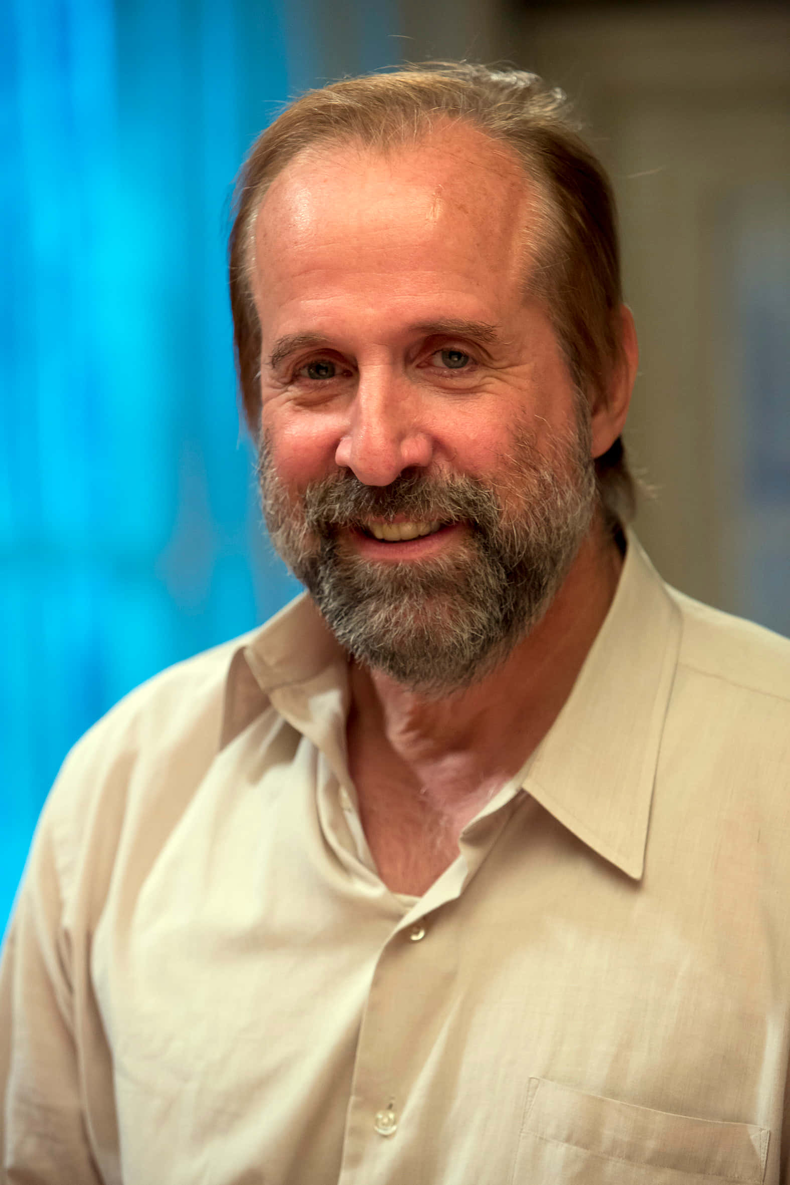 Peter Stormare, beige button-up shirt, blurred blue curtain background, Full HD Phone Wallpaper