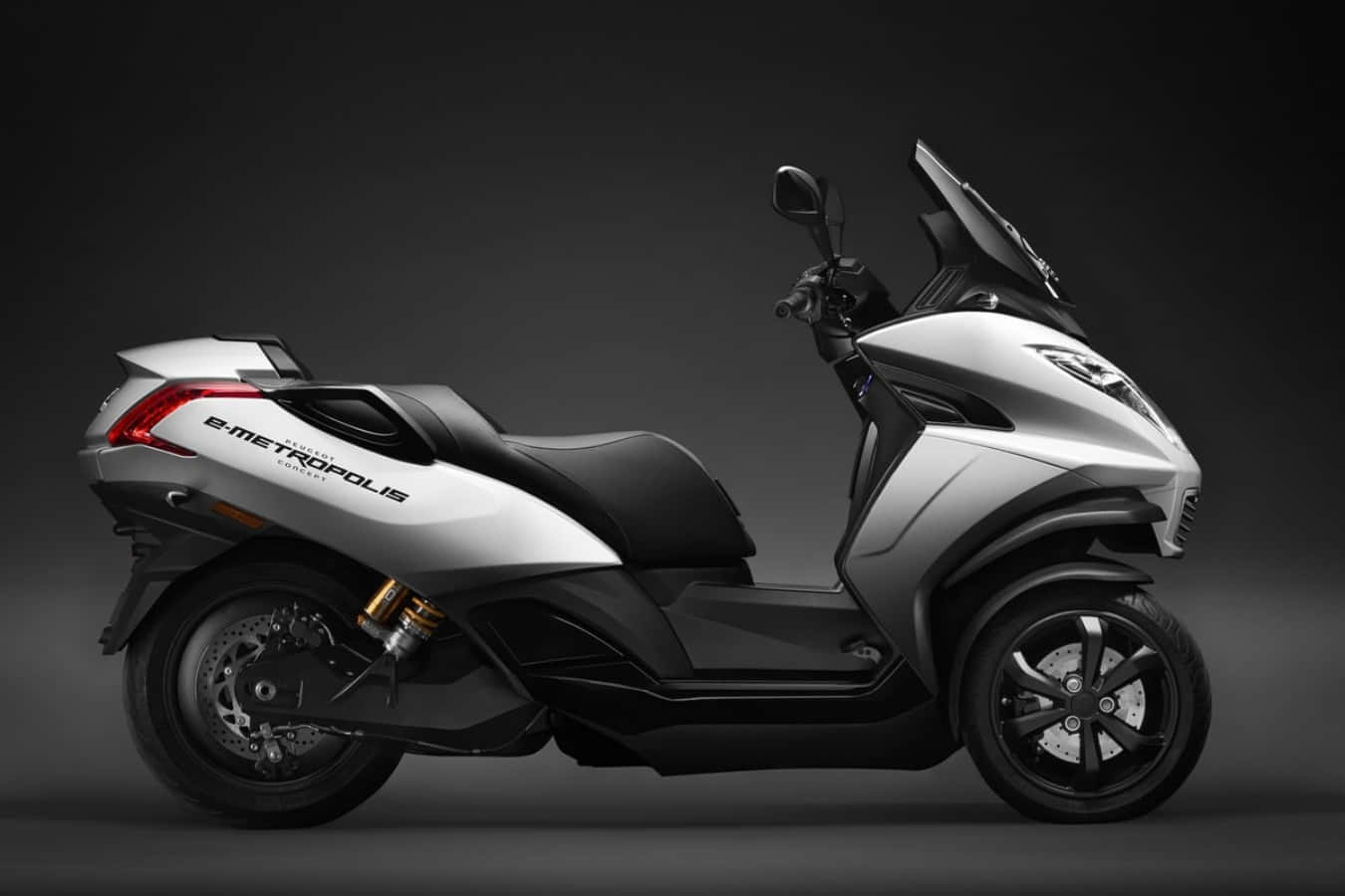 sleek silver and black e-metropolis scooter, urban backdrop, dark studio background, HD Desktop Wallpaper