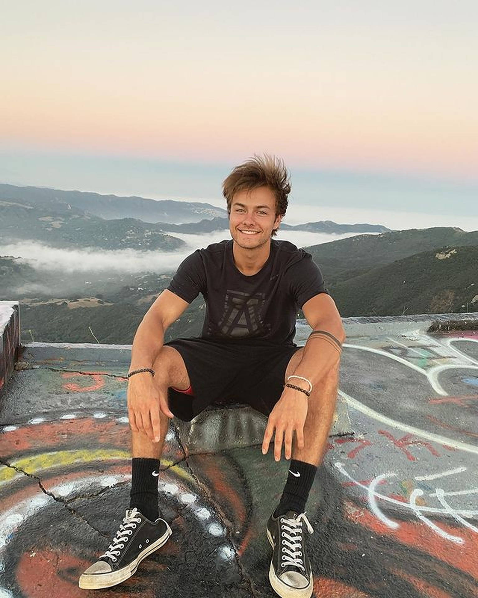Peyton Meyer, rooftop, graffiti-covered ledge, Full HD Phone Wallpaper