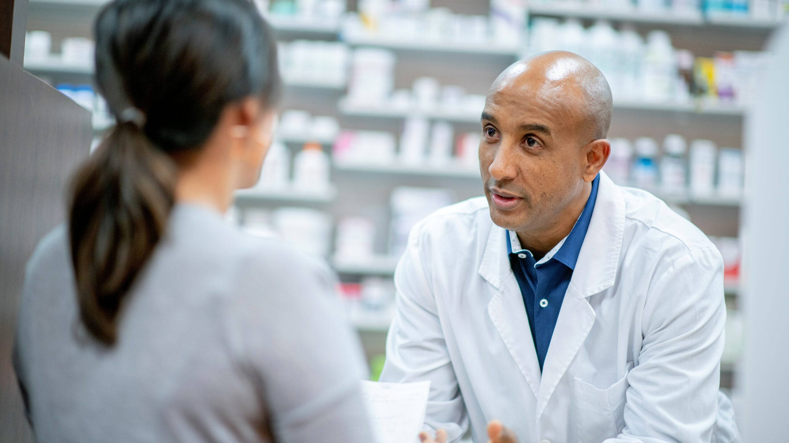 bald pharmacist, white coat, customer, 2K Desktop Wallpaper