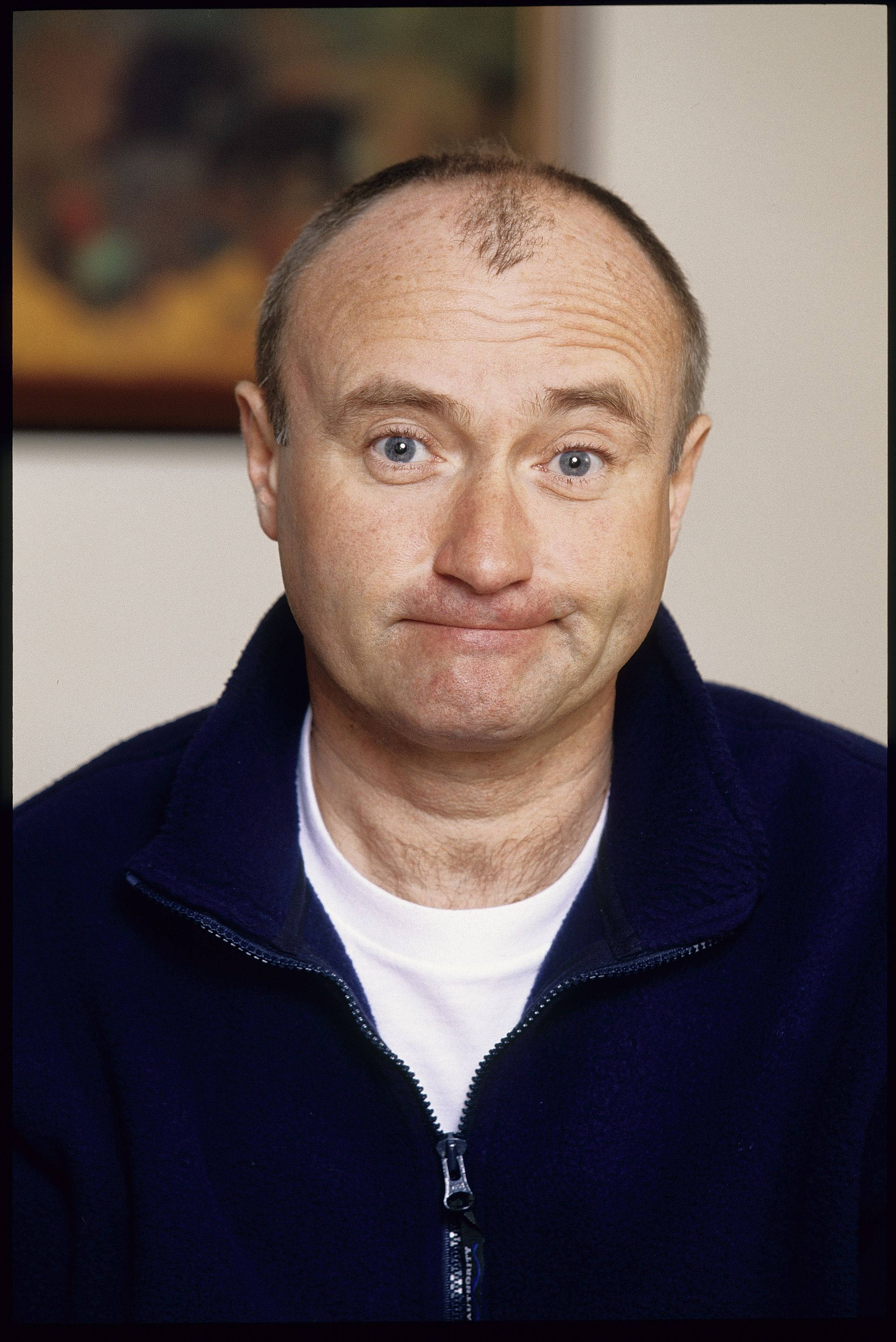 Phil Collins, navy zip-up jacket, white shirt, 2K Phone Wallpaper