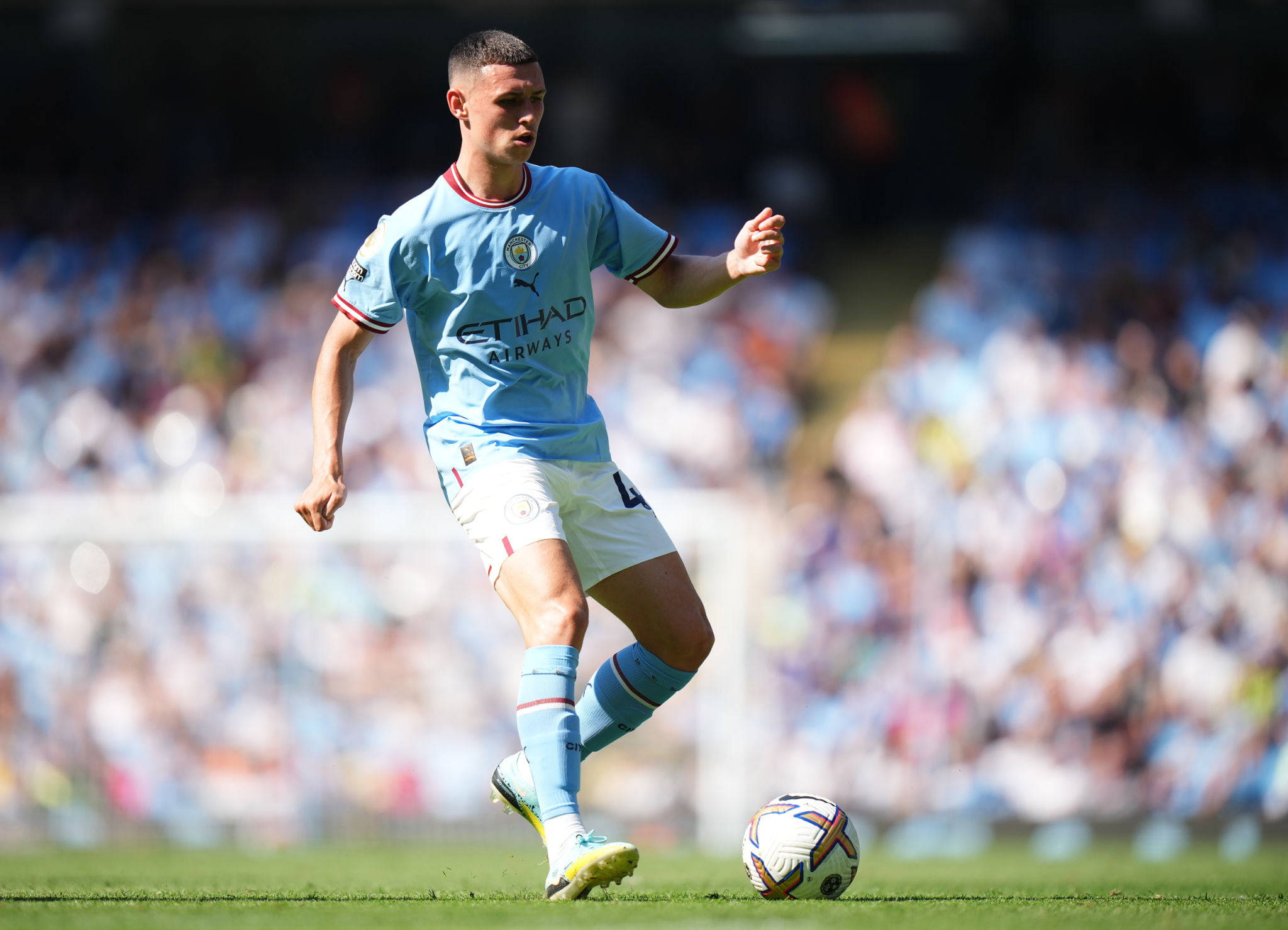 Phil Foden, light blue jersey, sunlit green pitch, Full HD Desktop Wallpaper