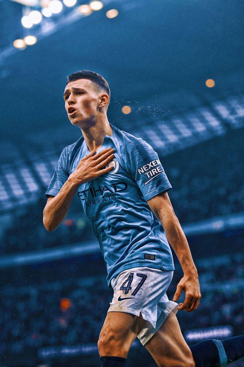 Phil Foden, light blue jersey, stadium lights, SD Phone Wallpaper