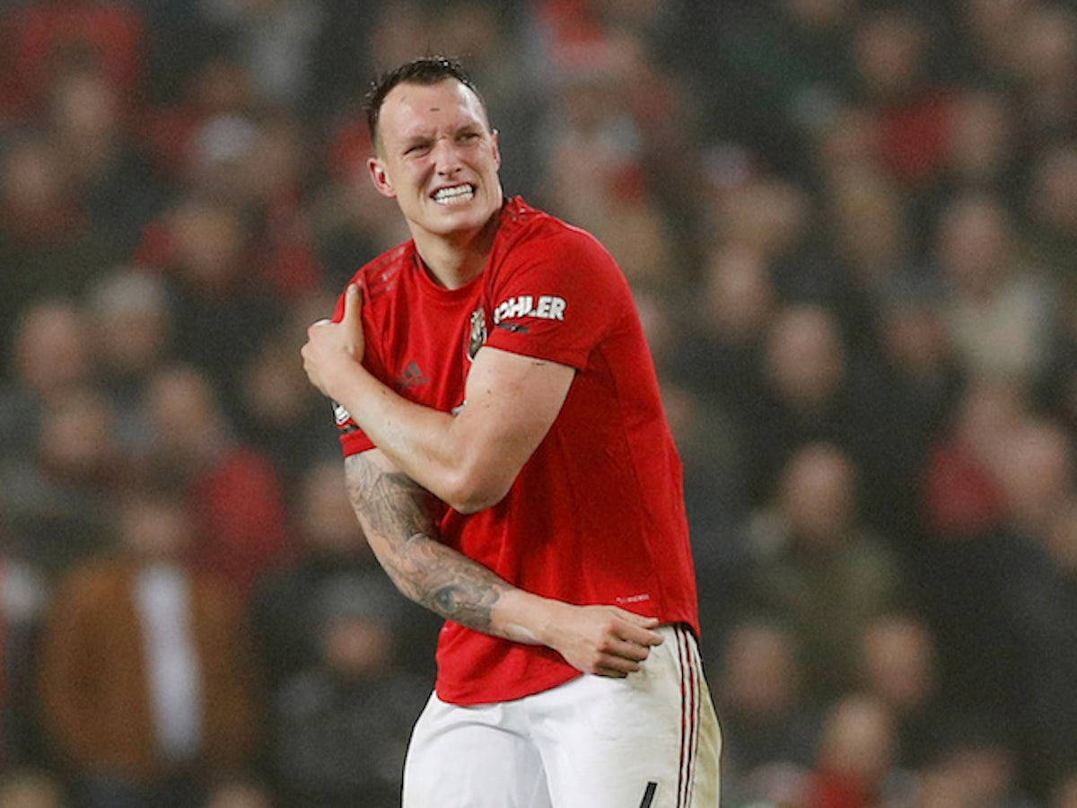 Phil Jones, red jersey, stadium pitch, SD Desktop Wallpaper