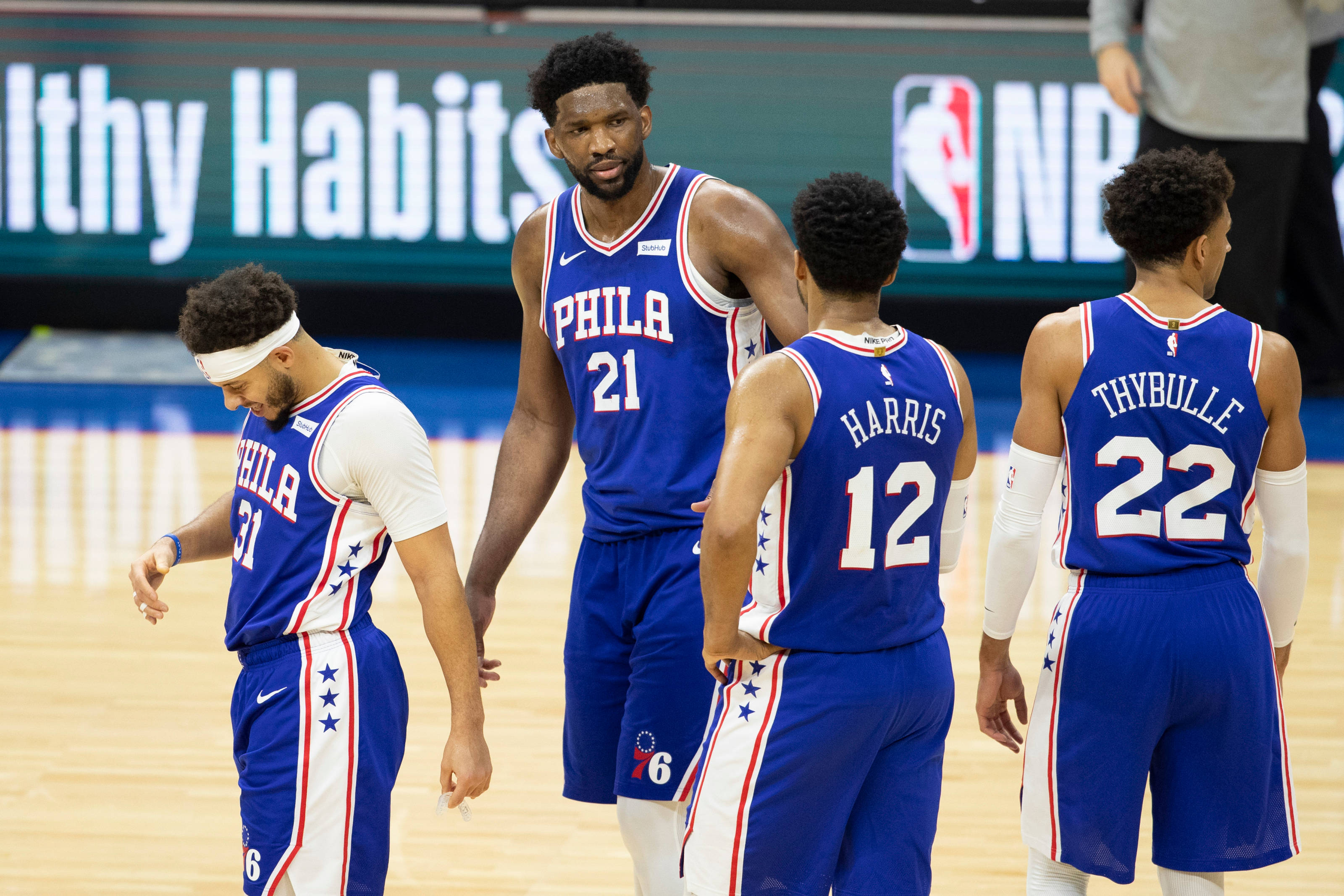 Philadelphia 76ers, blue and white uniforms, polished wooden court, 2K Desktop Wallpaper