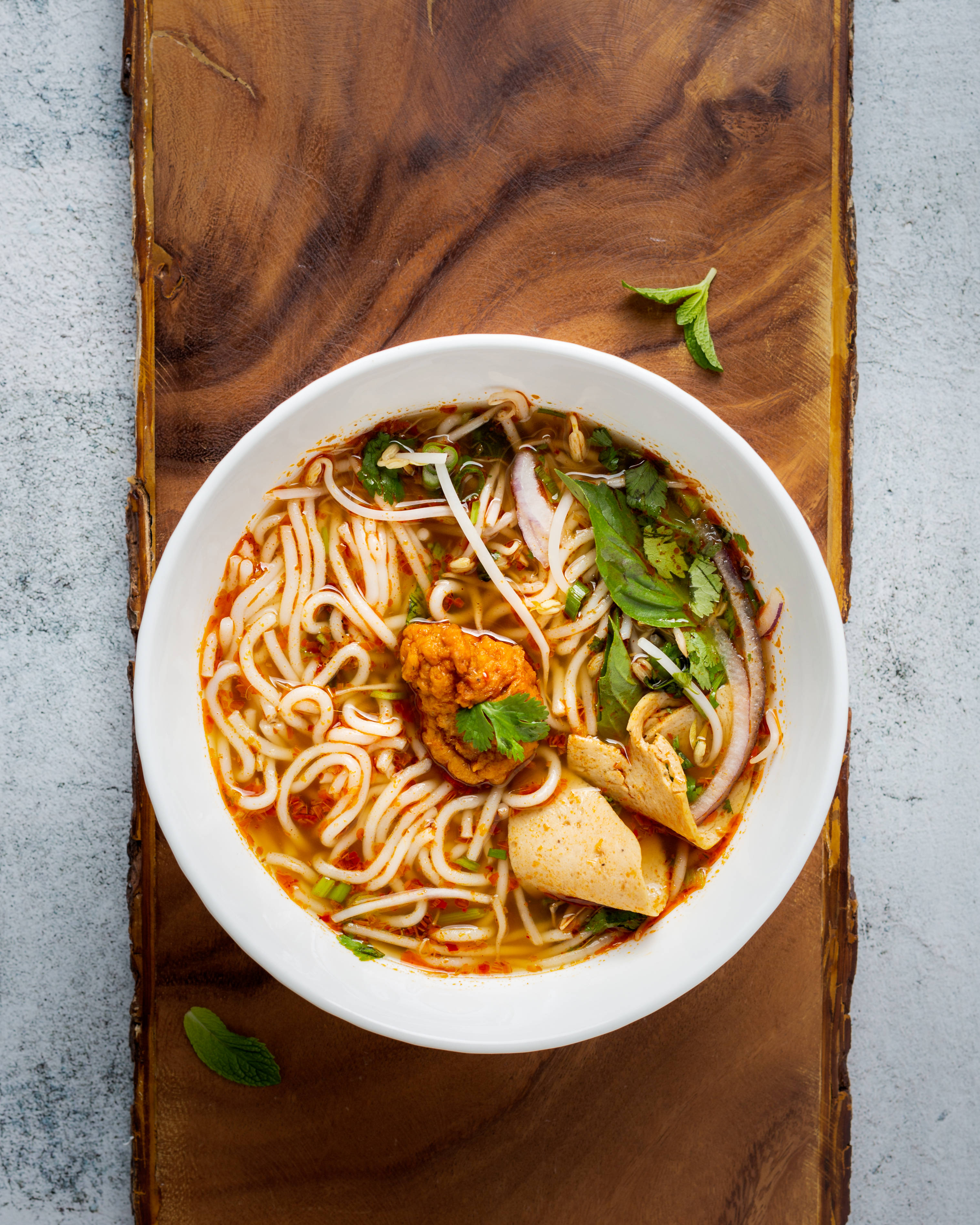 Pho, spicy red broth, steaming bowl, 2K Phone Wallpaper