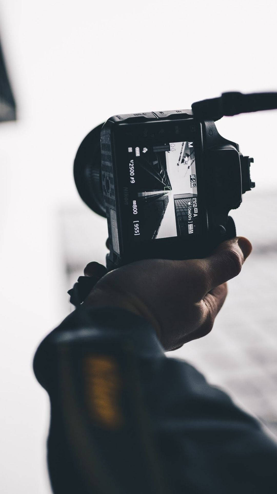 DSLR camera, viewfinder, high-contrast urban scene, Full HD Phone Wallpaper
