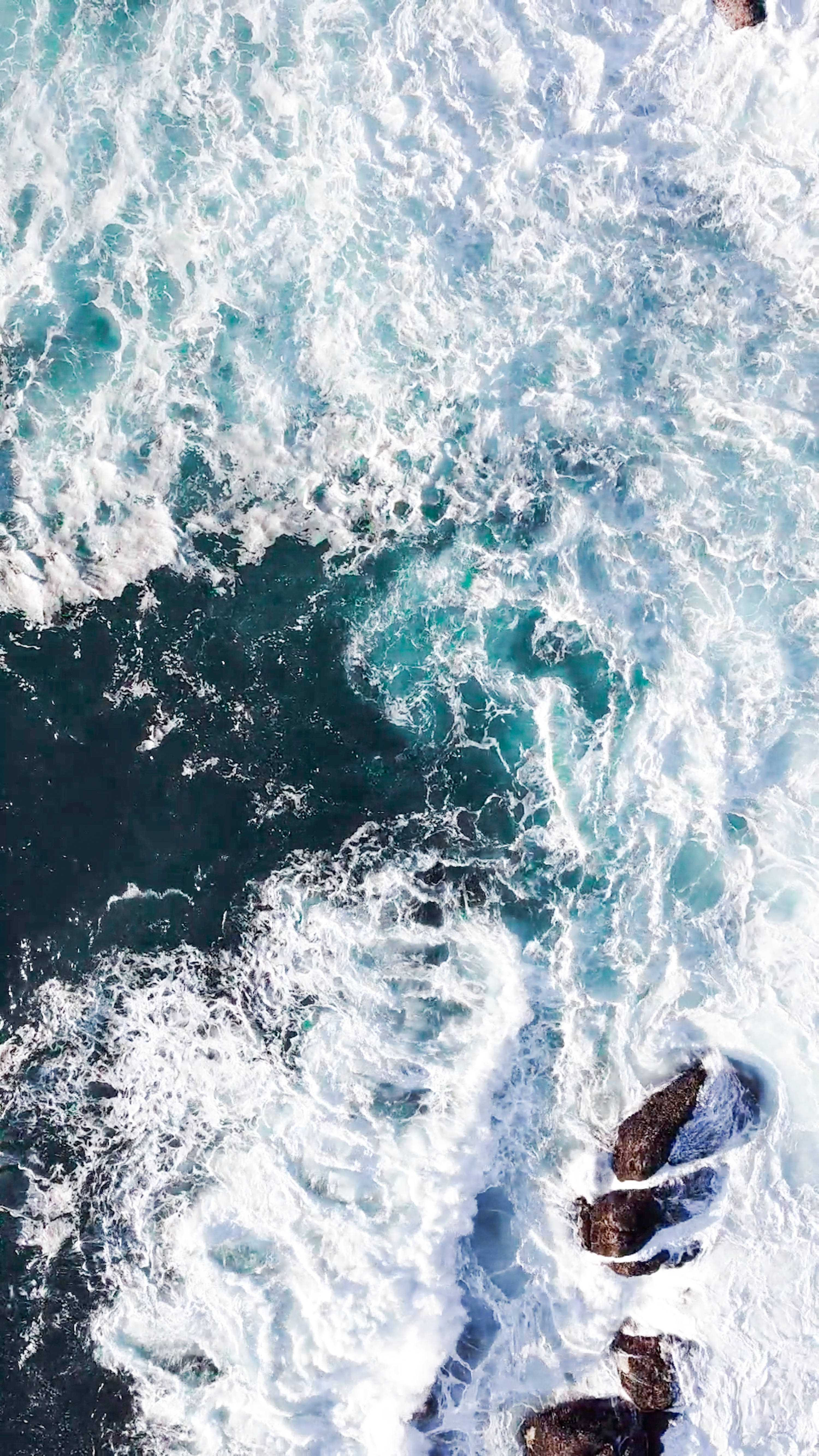 turquoise ocean, dark rocks, white foam, 5K Phone Wallpaper