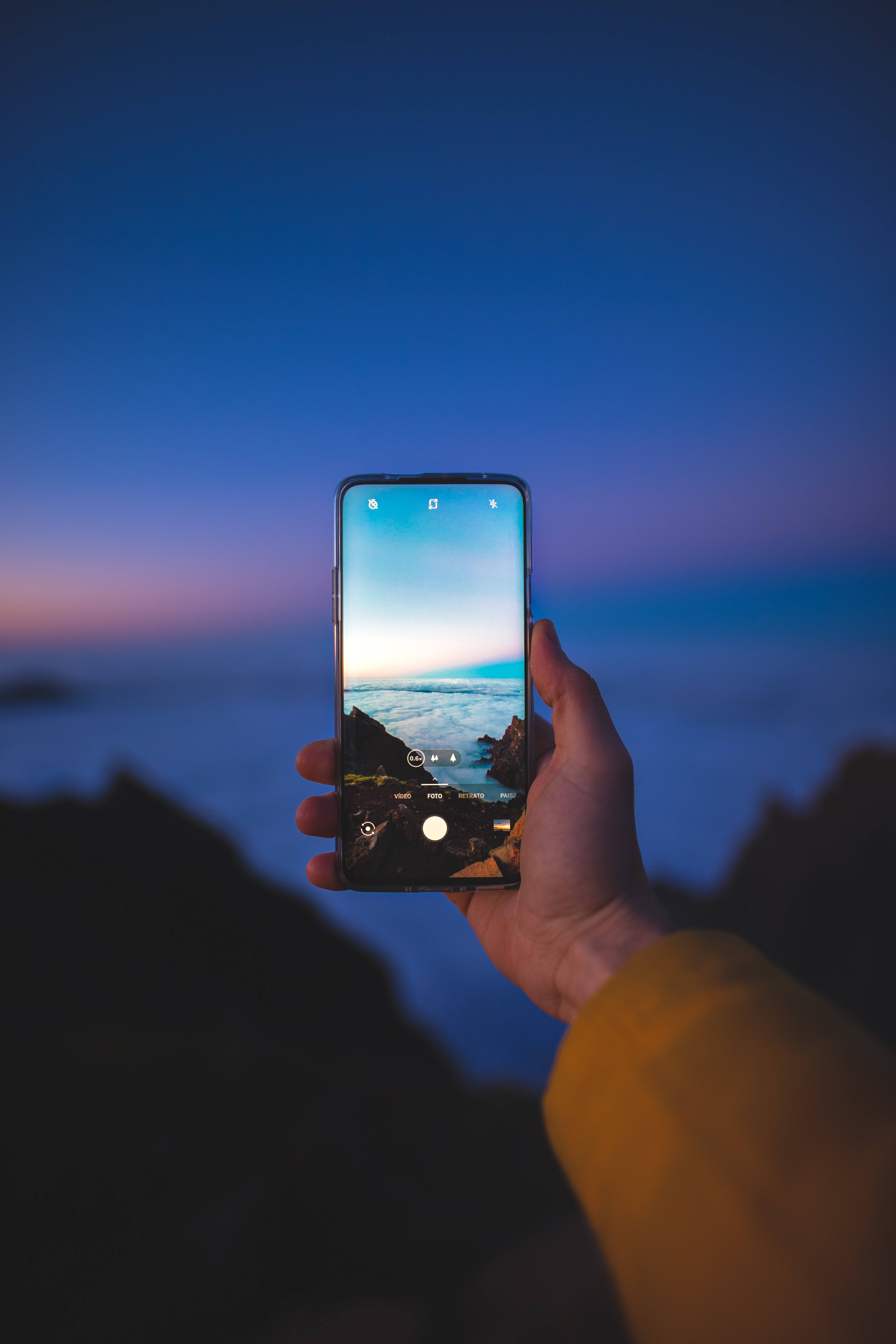 smartphone, coastal sunset, vibrant purple and blue skies, 5K Phone Wallpaper