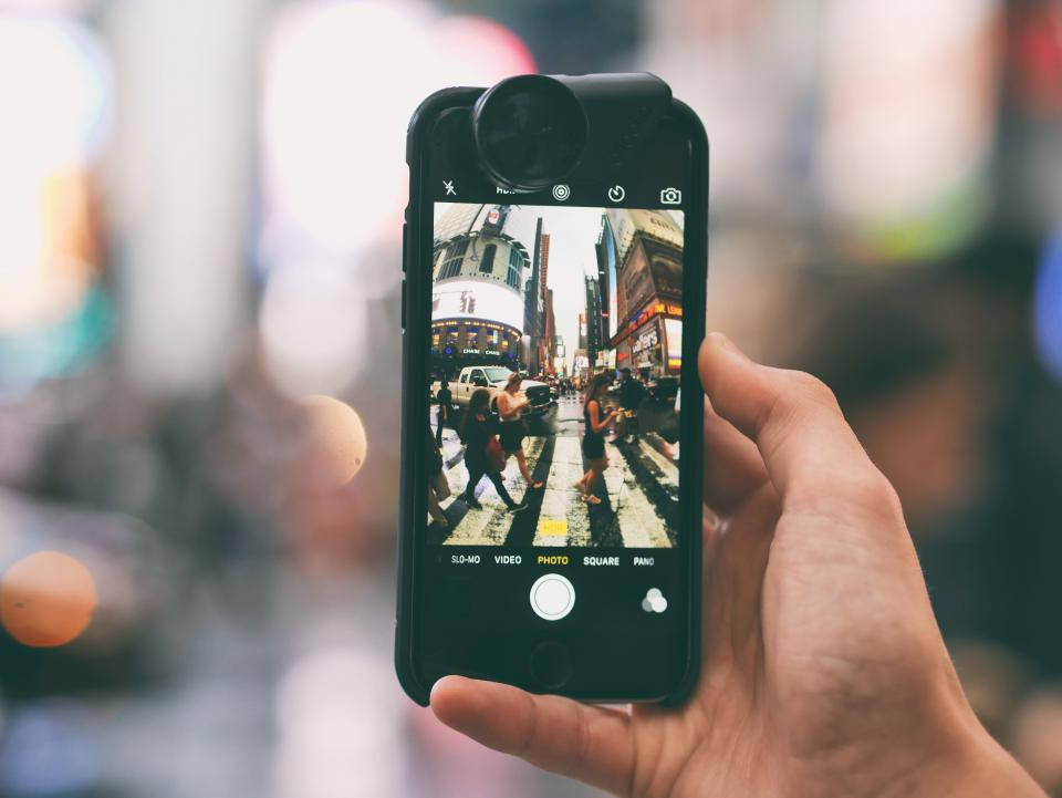 smartphone, bustling city street, pedestrians crossing a crosswalk, SD Desktop Wallpaper