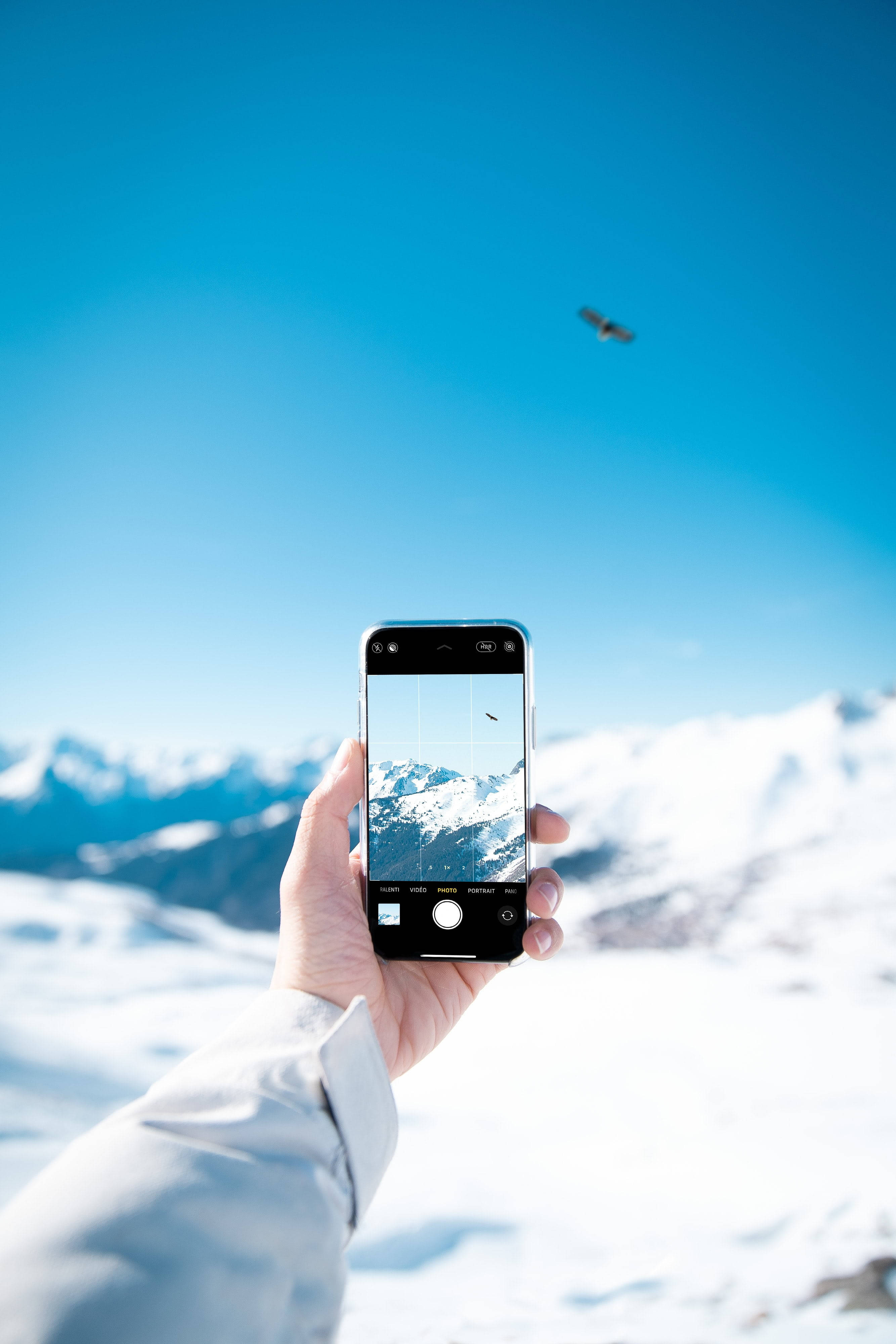 smartphone, snowy mountain range, clear blue sky, 4K Phone Wallpaper