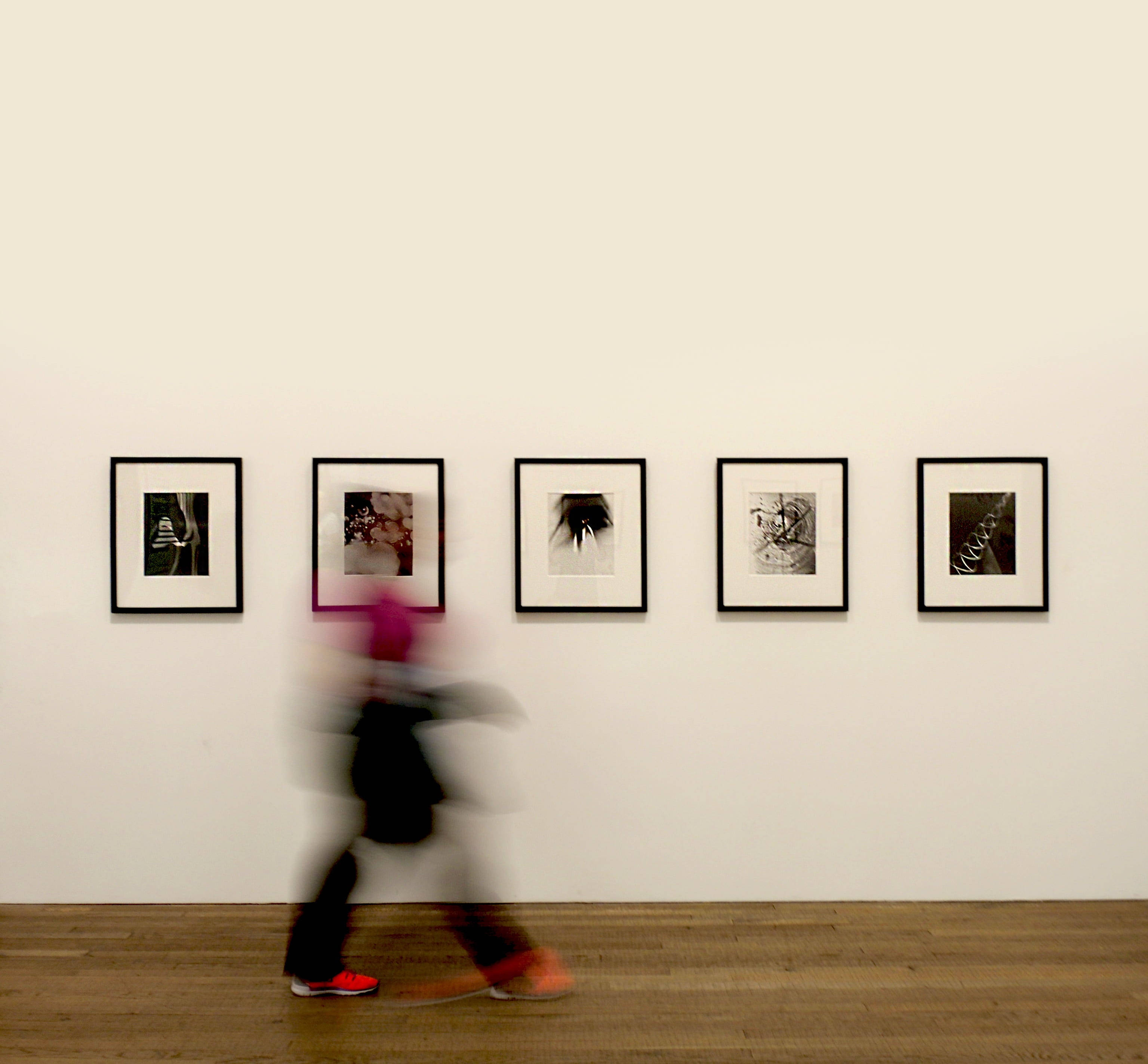 black and white artworks, white gallery wall, wooden floor, 2K Desktop Wallpaper