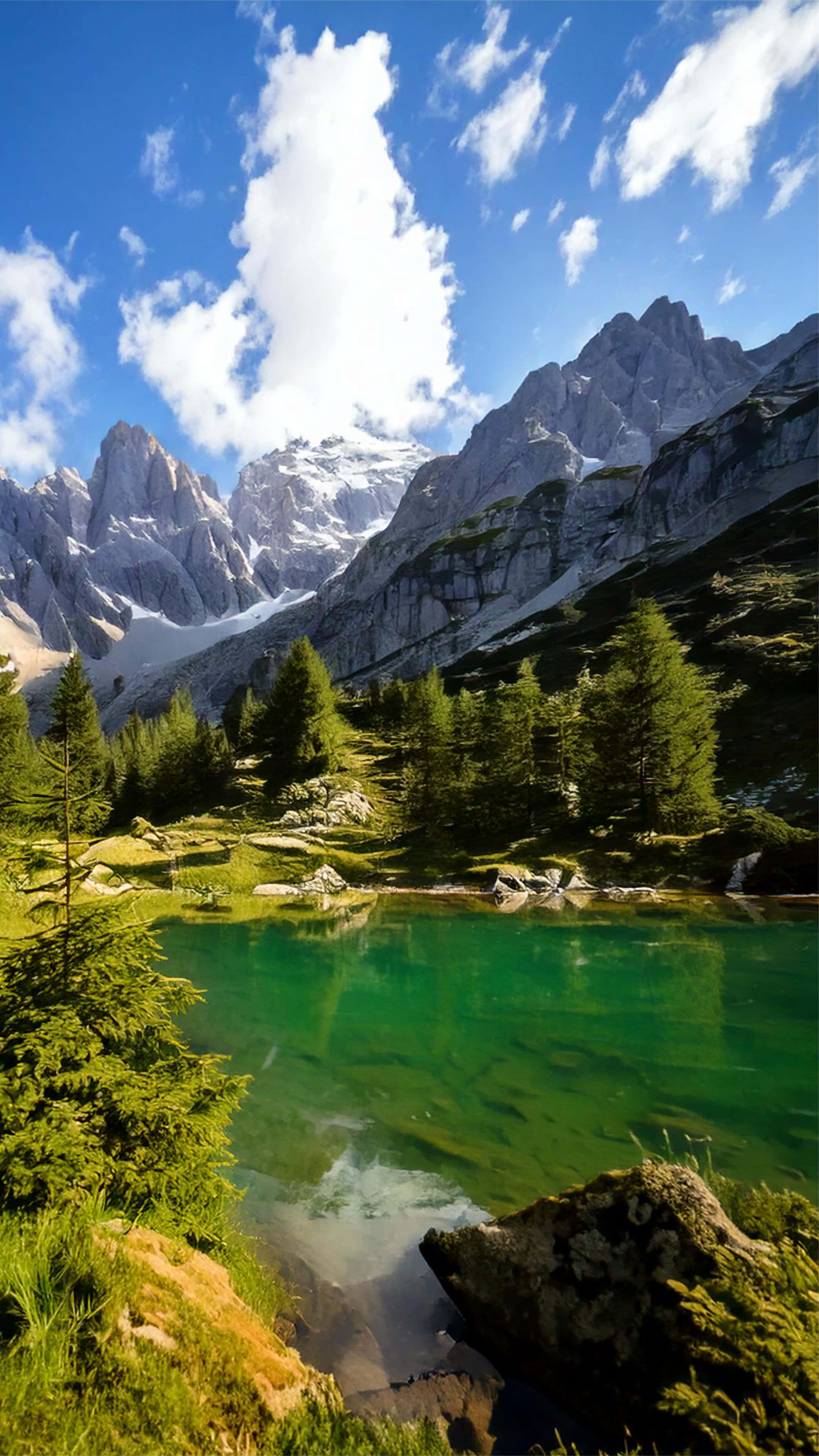 alpine lake, snowcapped peaks, bright blue sky, 4K Phone Wallpaper