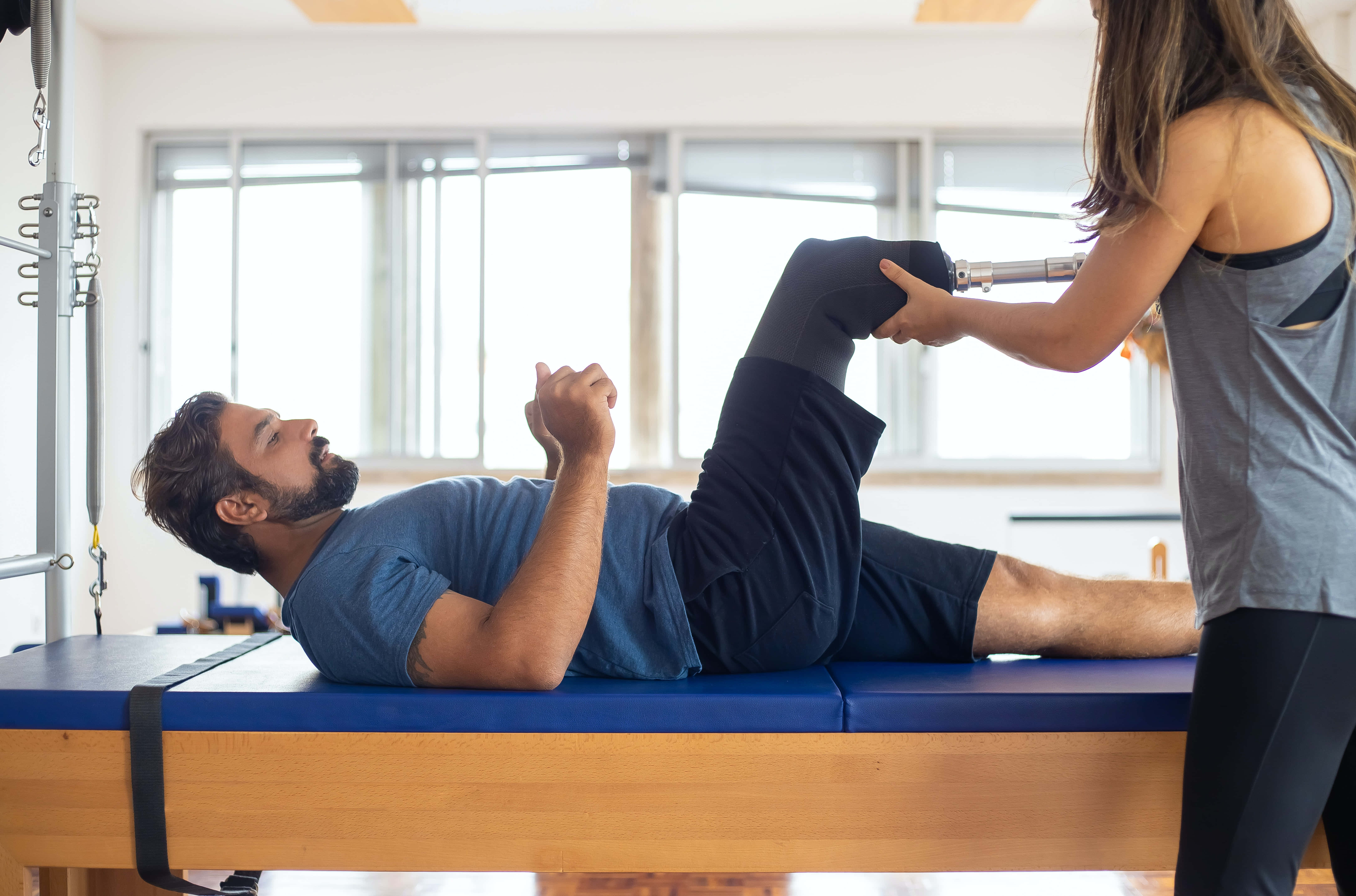 physical therapy prosthetic leg, blue therapy table, female physical therapist, 5K Desktop Wallpaper
