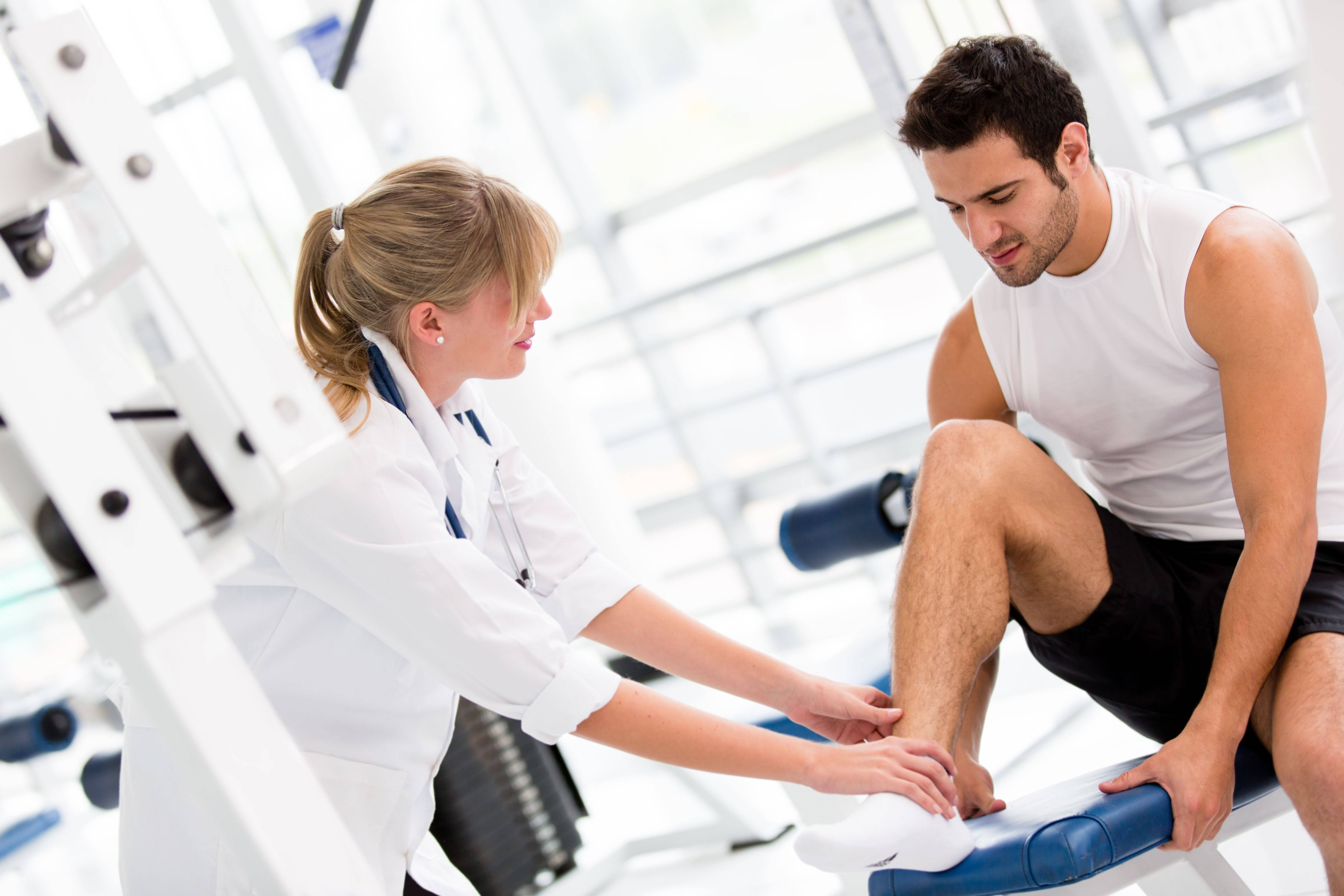 female physiotherapist, man's ankle, bright modern gym, 5K Desktop Wallpaper