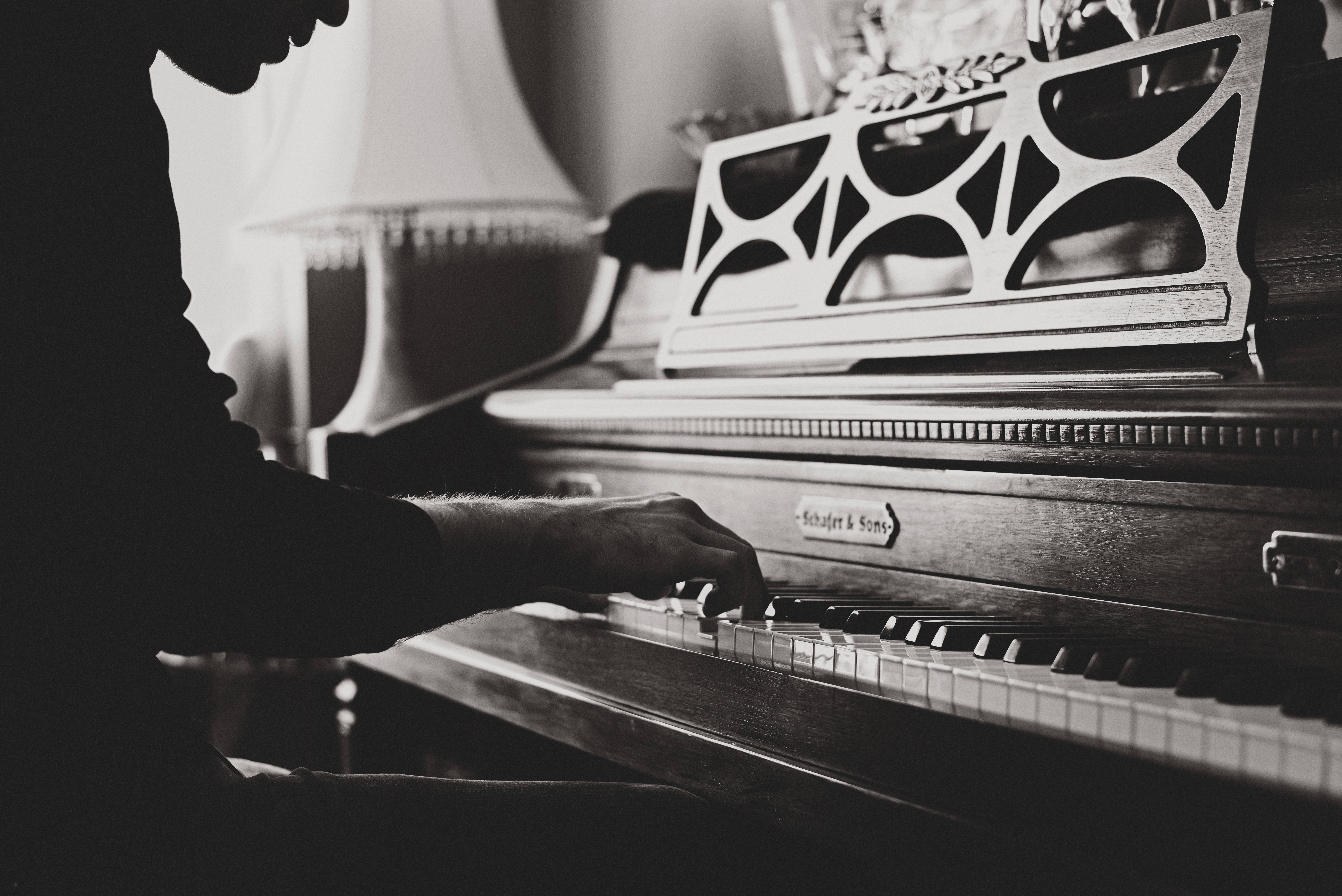piano silhouette, vintage pianist, dimly lit room, 5K Desktop Wallpaper