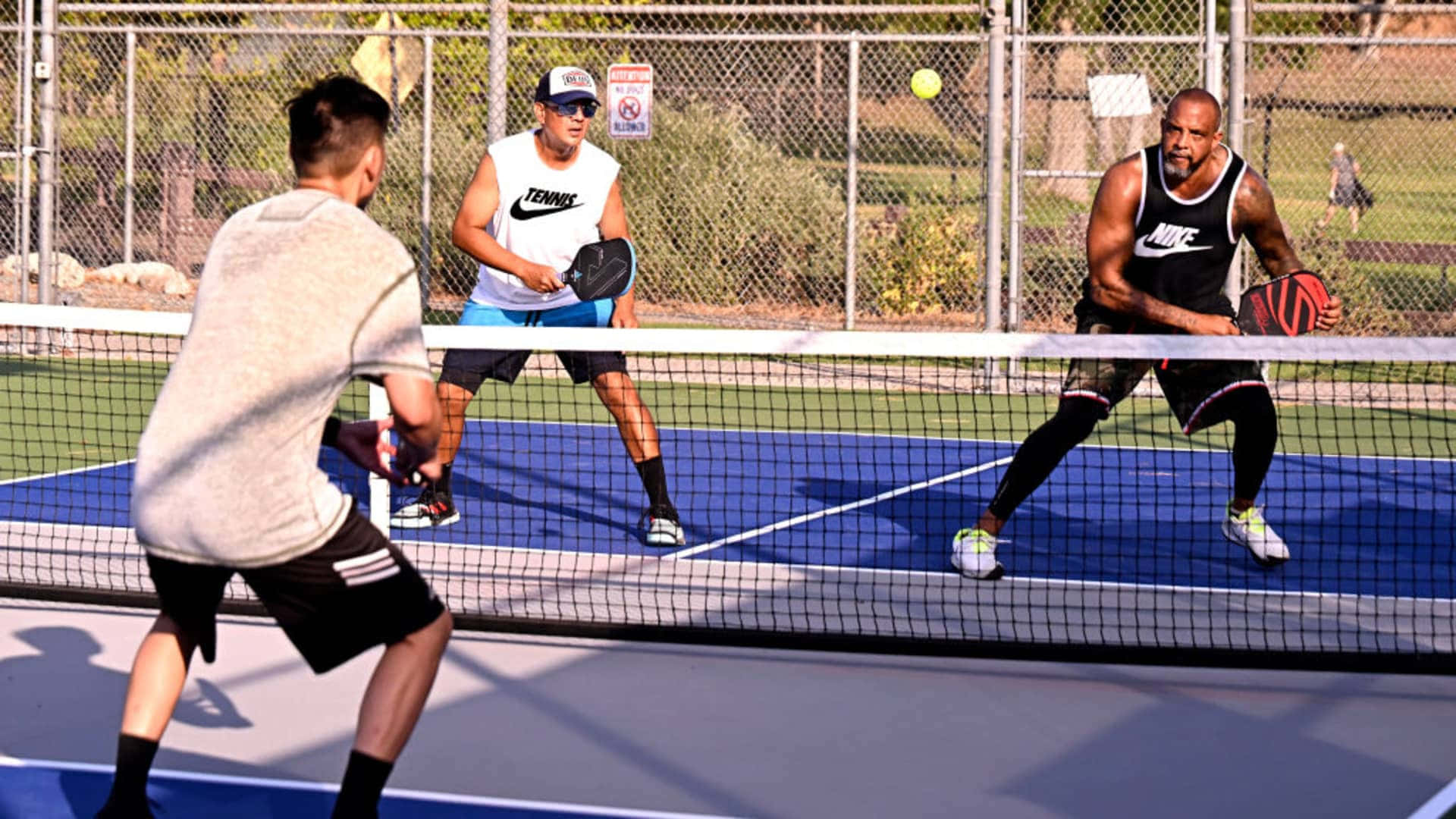 intense pickleball match, bright blue court, clear daylight, Full HD Desktop Wallpaper