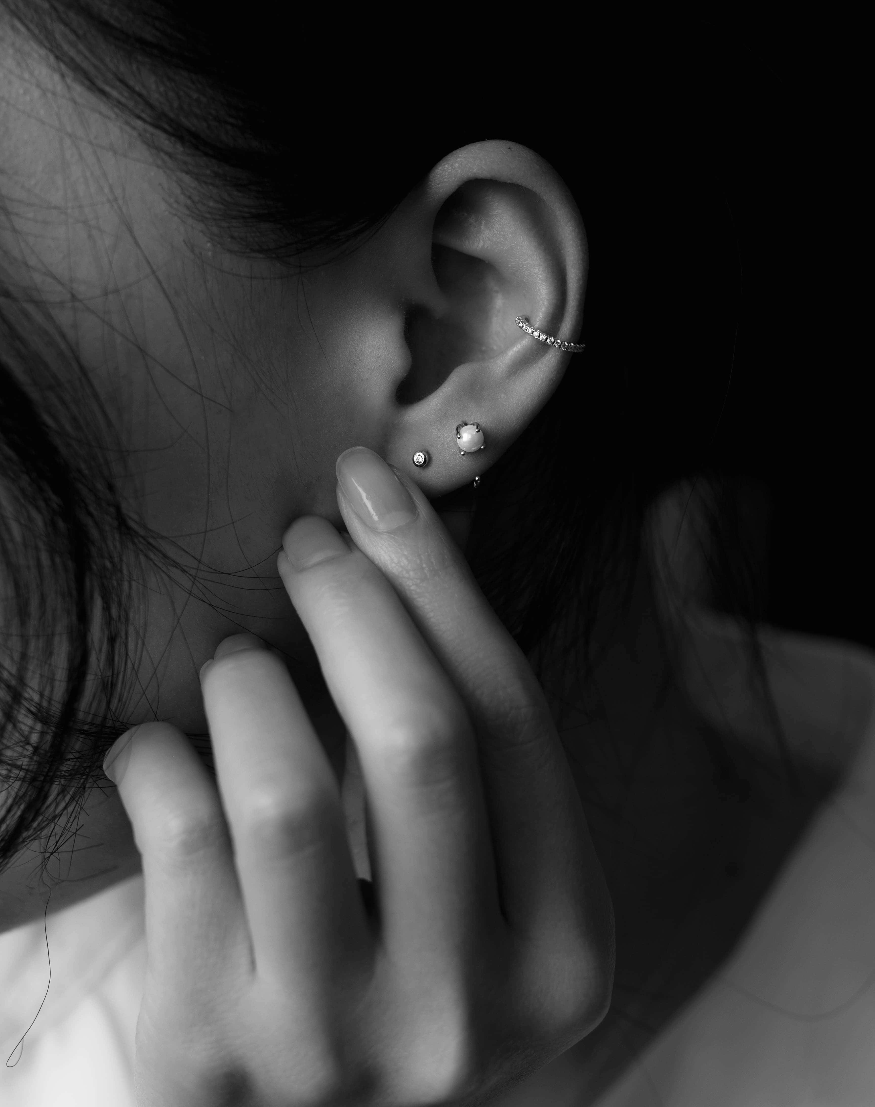 second ear piercing, black and white, close-up, 4K Phone Wallpaper