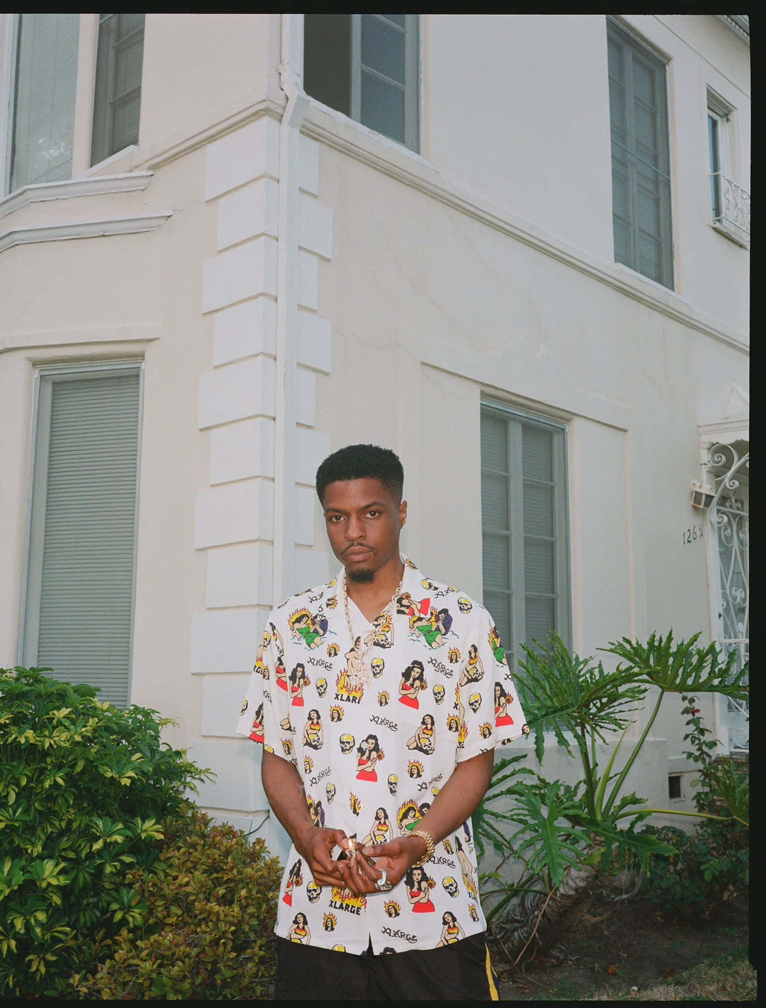Pierre Bourne, colorful graphic shirt, white stucco building, Full HD Phone Wallpaper