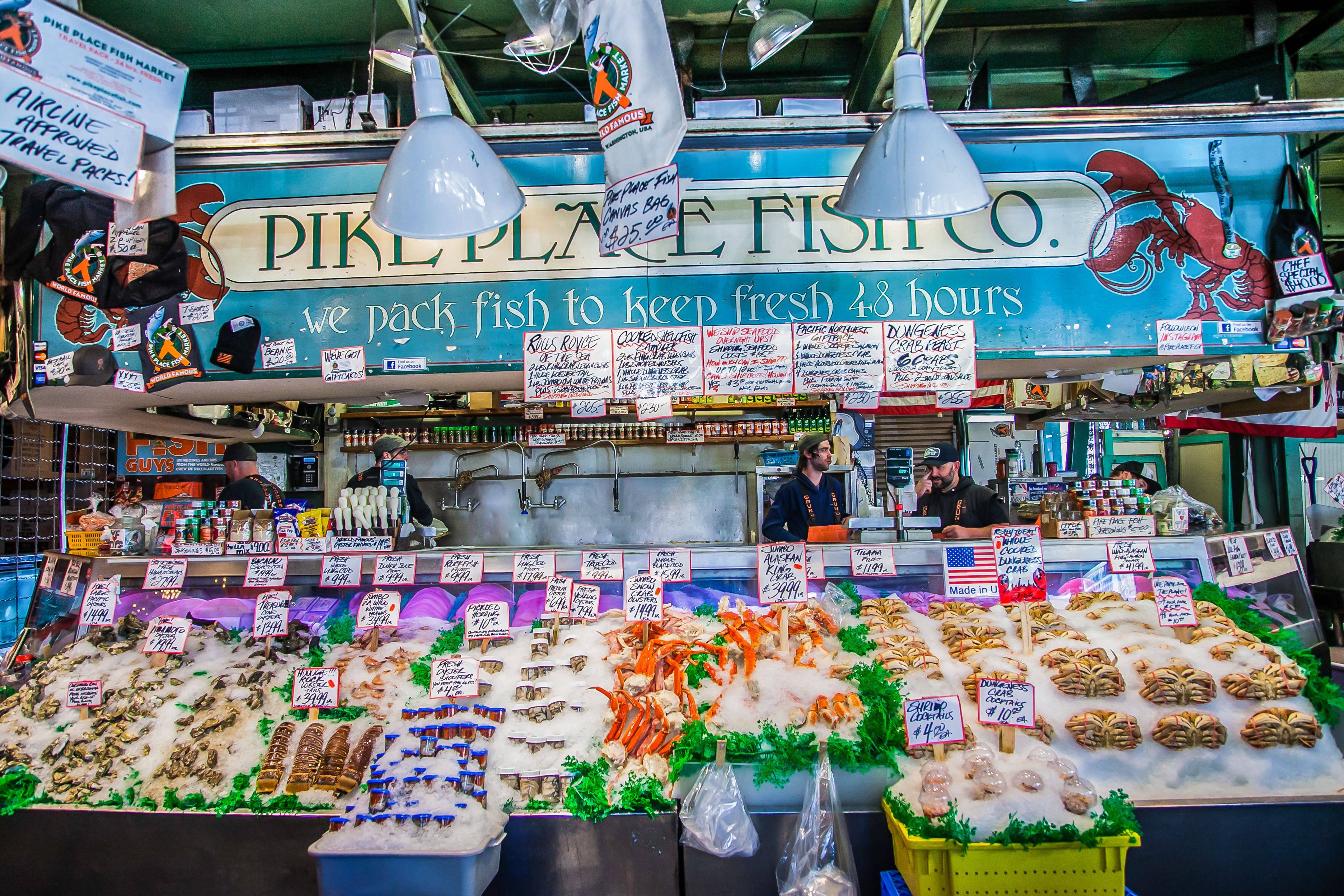 Pike Place Market, fresh seafood display, fish market stall, 2K Desktop Wallpaper