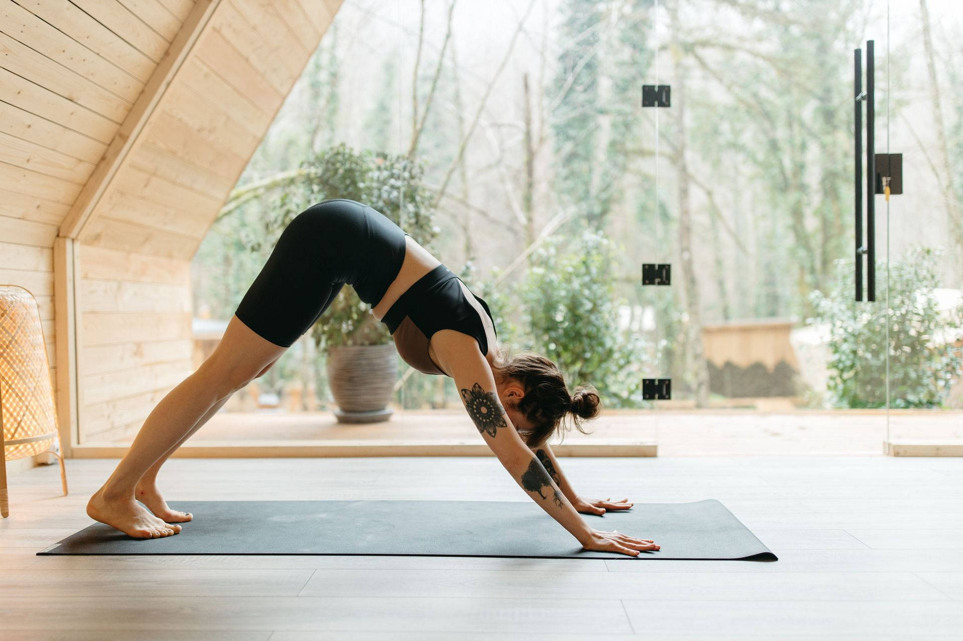 downward dog yoga pose, black athletic wear, wooden cabin, Full HD Desktop Wallpaper