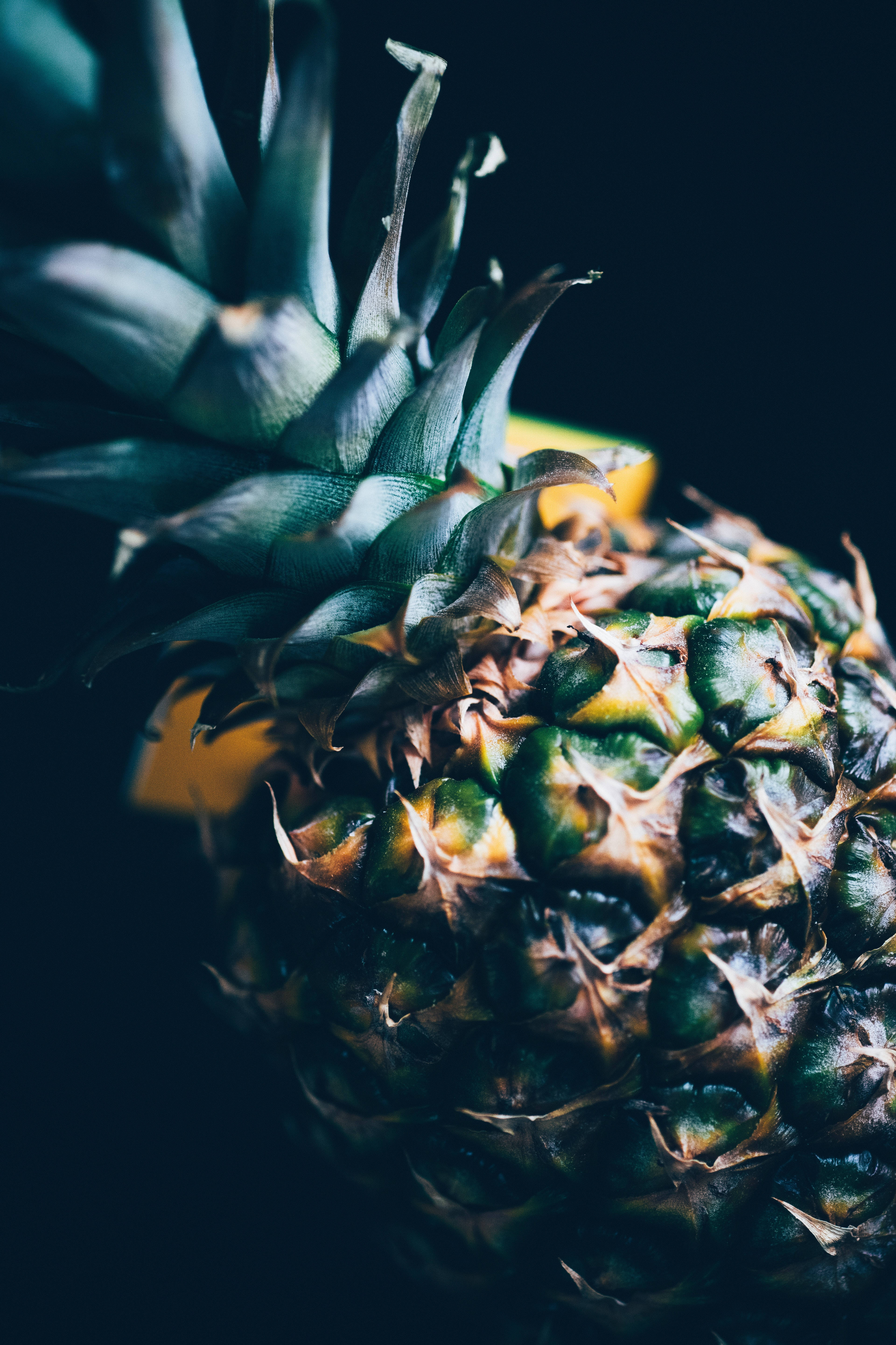 Pineapple, textured green and yellow skin, dark background, 5K Phone Wallpaper