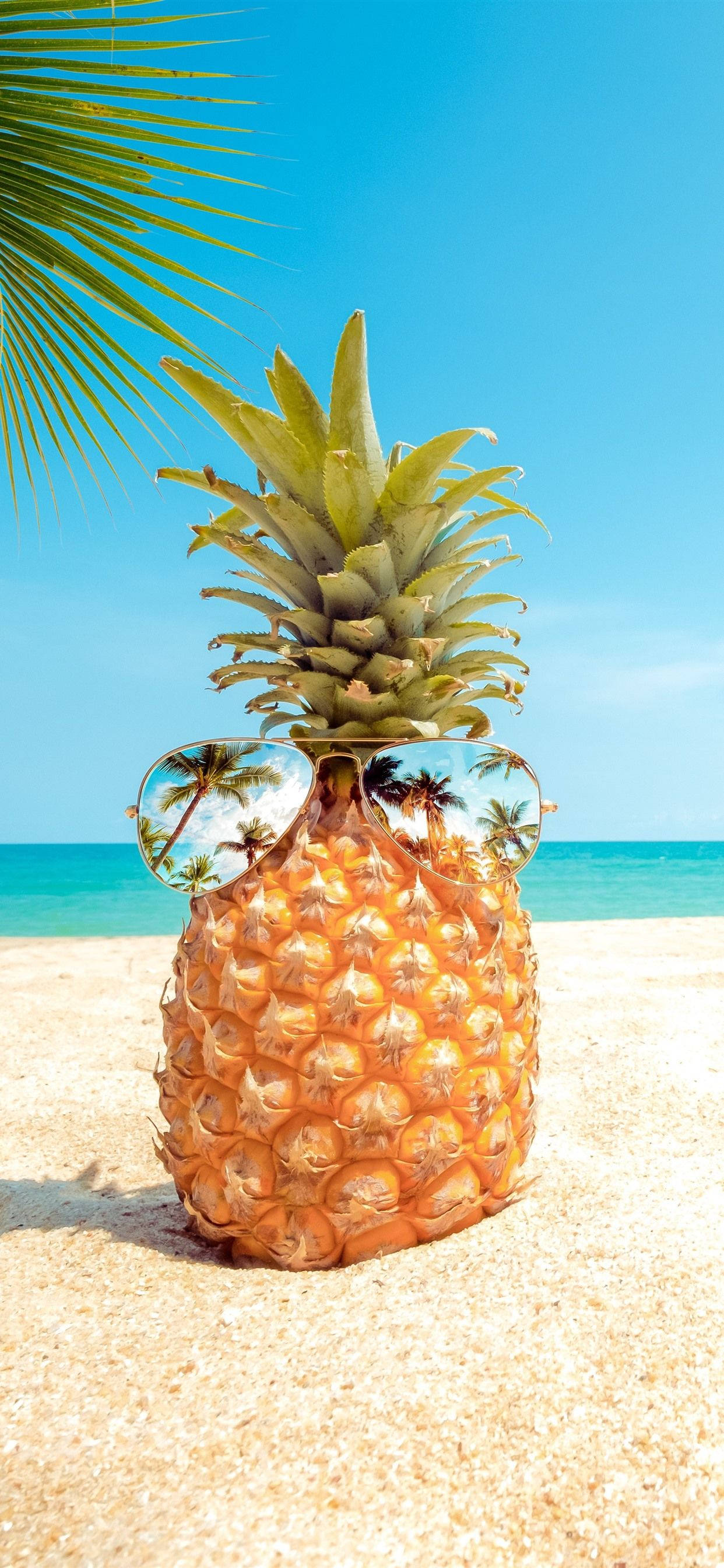 Pineapple iPhone, sunglasses, sandy beach, 2K Phone Wallpaper