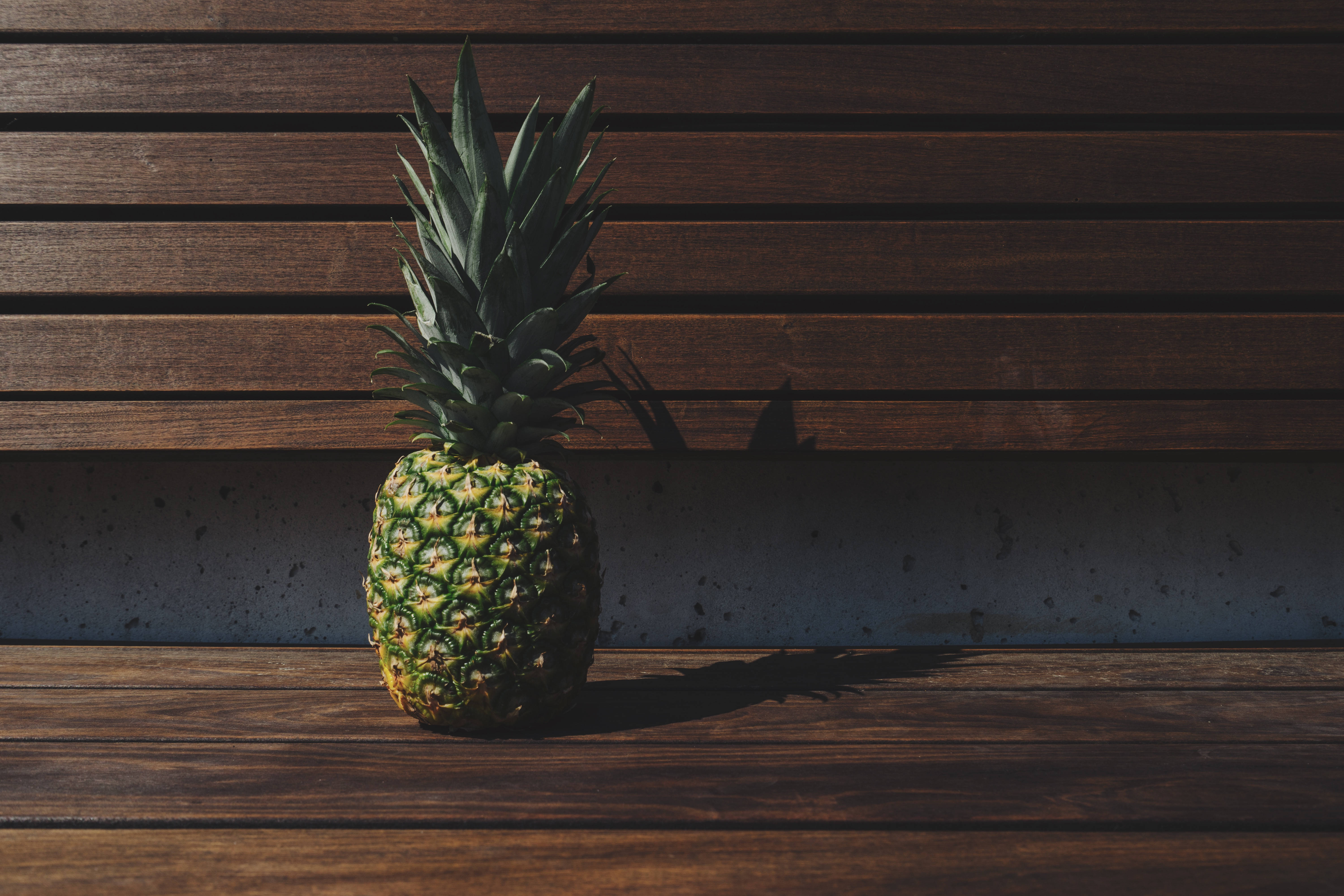 pineapple, weathered wooden bench, concrete wall, 5K Desktop Wallpaper