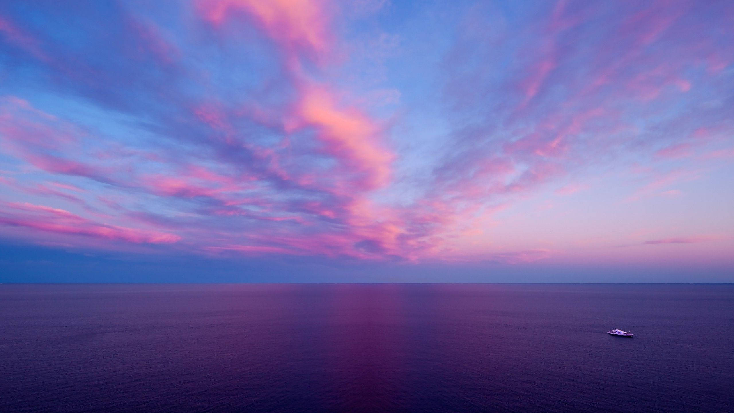 yacht, calm purple waters, dramatic sky, 2K Desktop Wallpaper