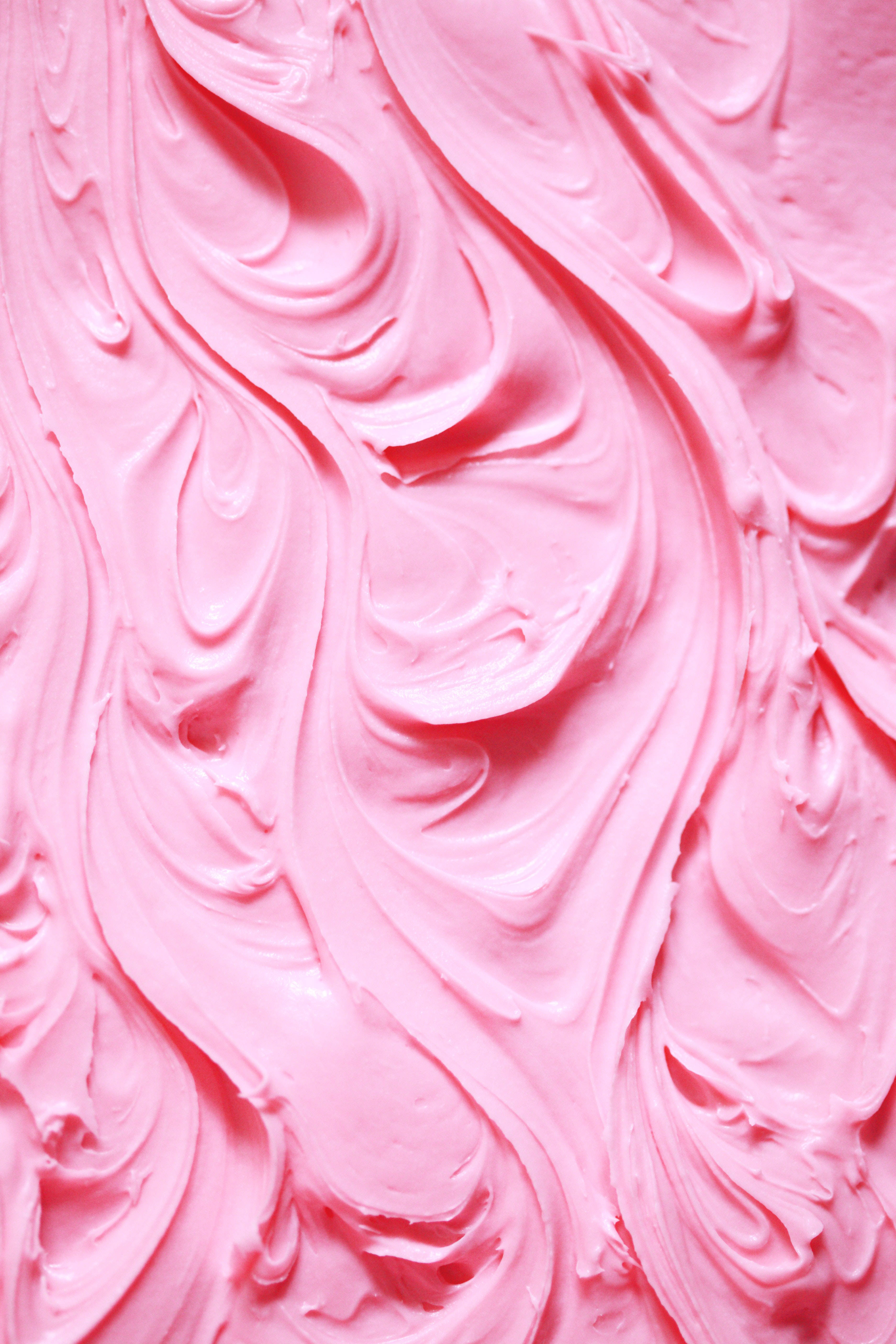 glossy pink frosting, swirling peaks and valleys, soft sweet texture, 5K Phone Wallpaper