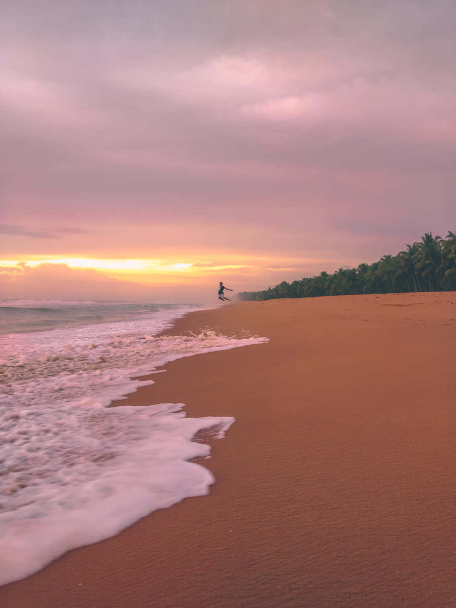 pink-hued tropical beach, sunset, waves, SD Phone Wallpaper