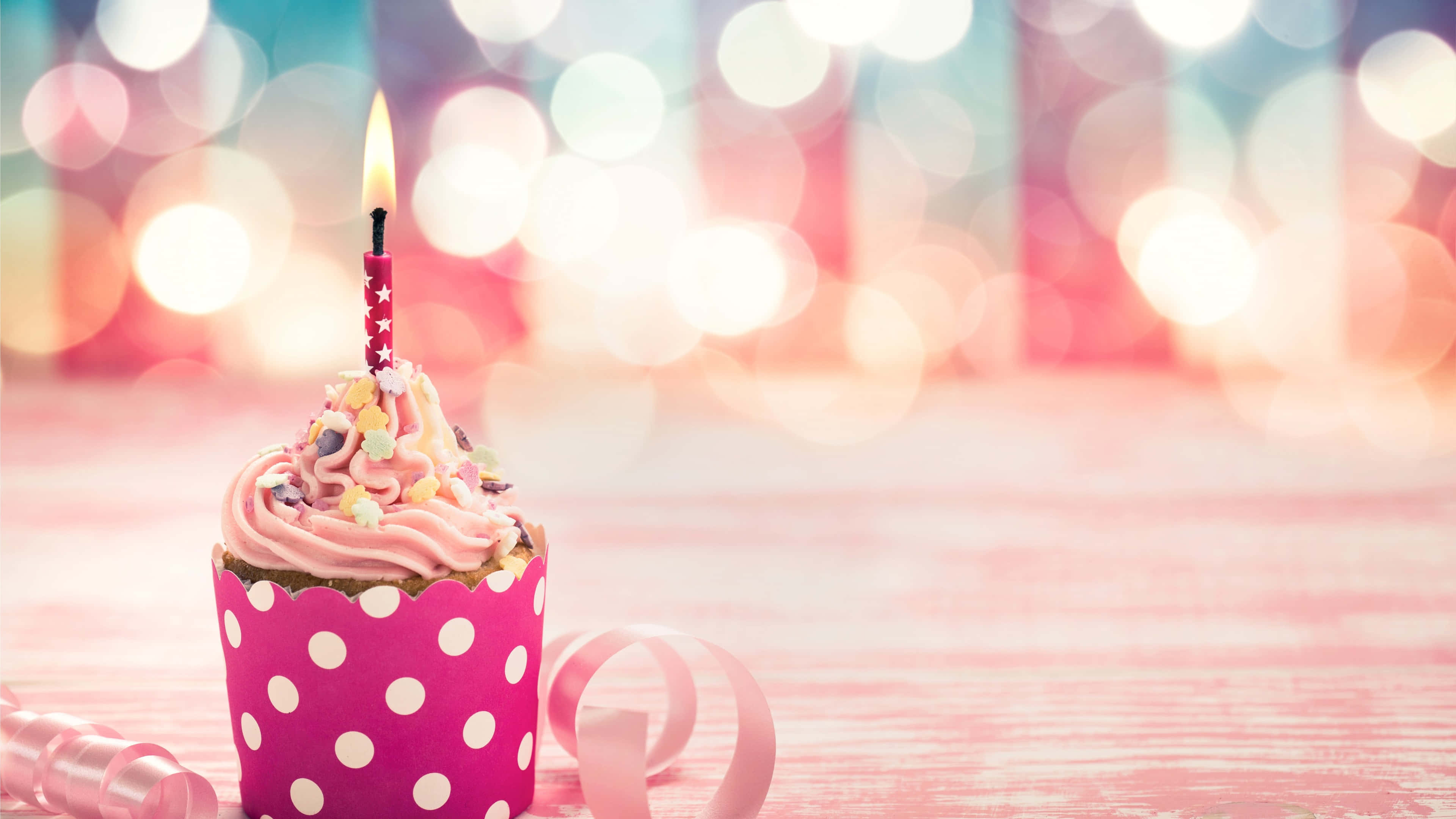 pink cupcake, lit candle, colorful sprinkles, 4K Desktop Wallpaper