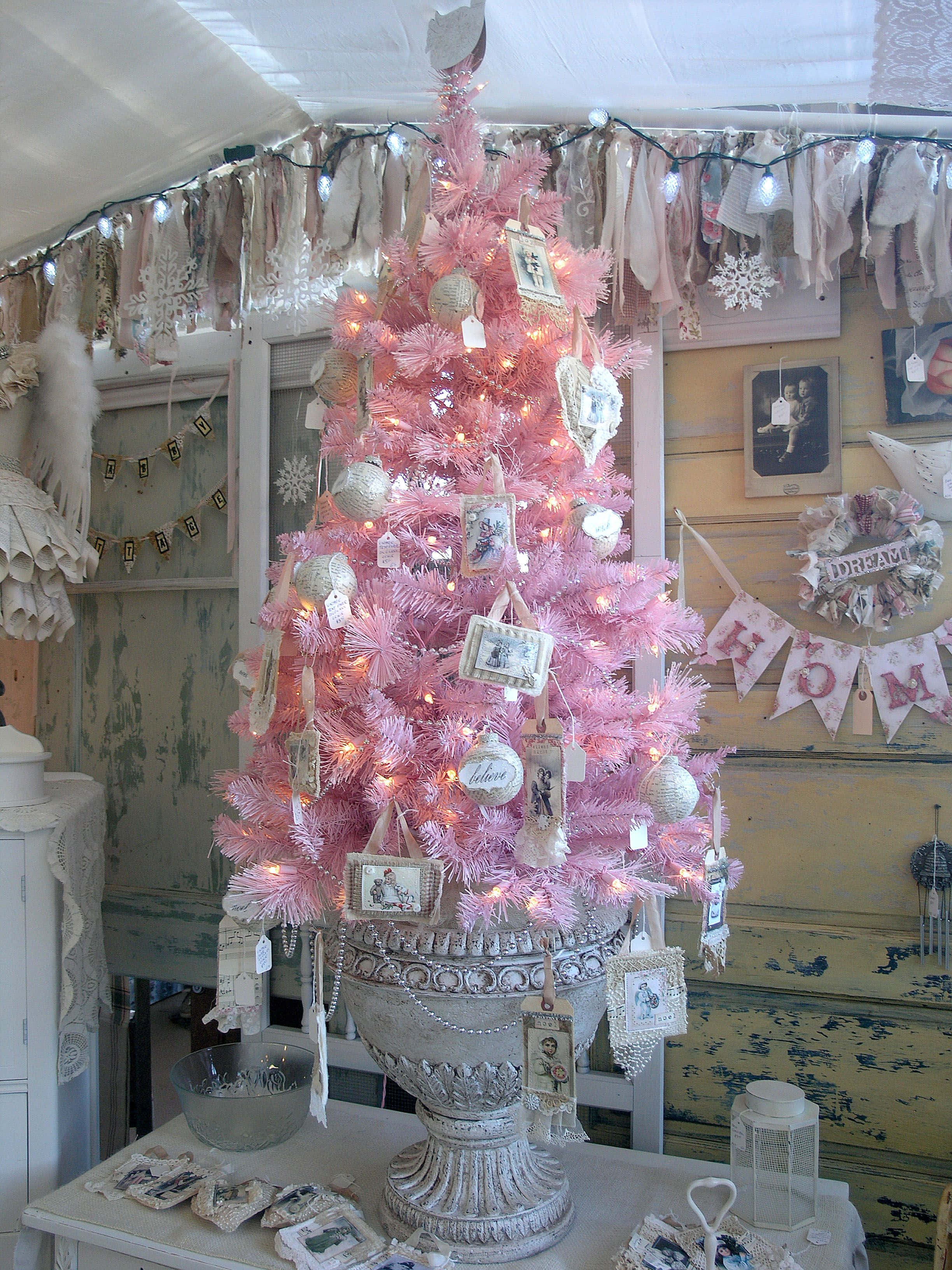 vintage pink Christmas tree, framed photos, fairy lights, 2K Phone Wallpaper