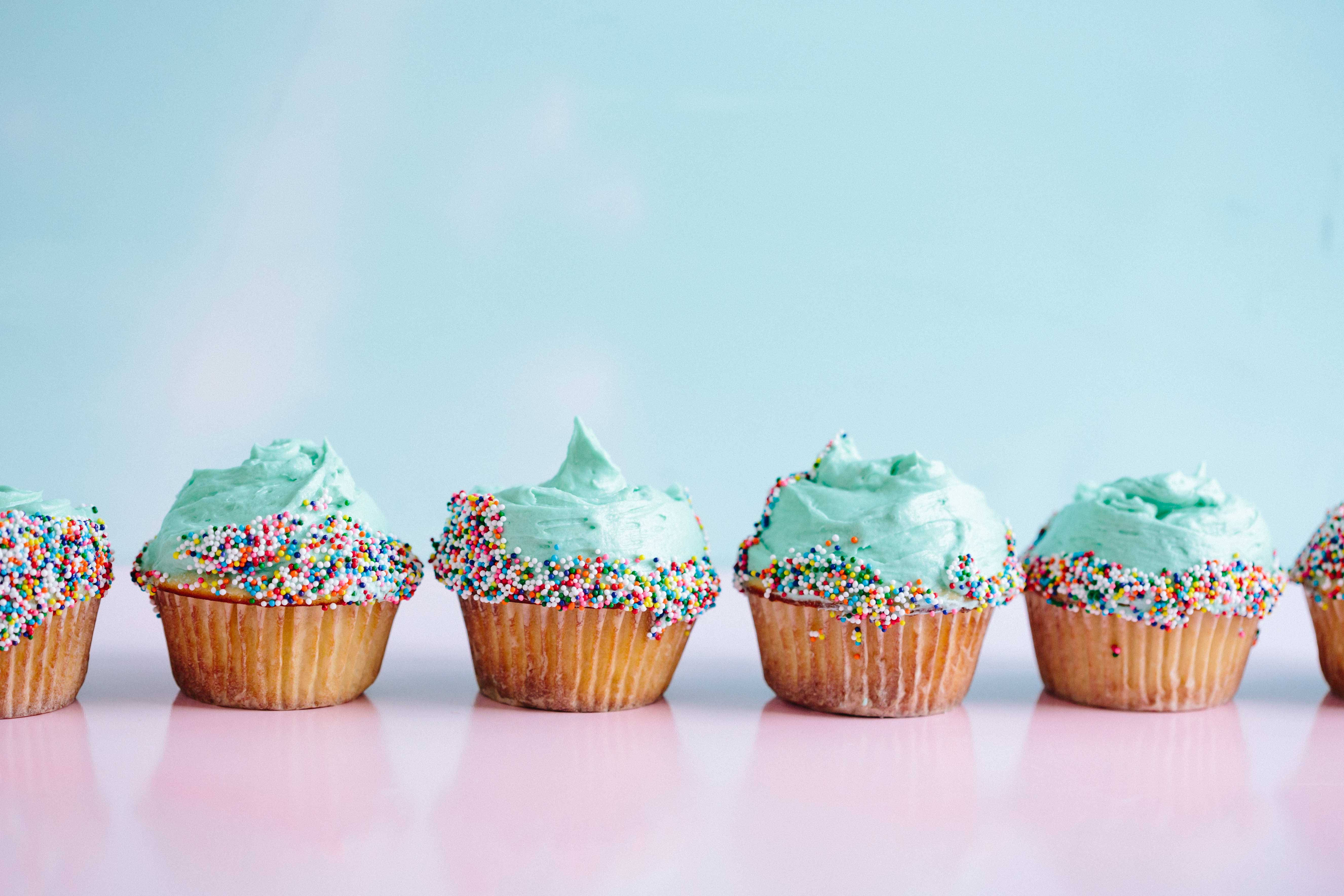 mint green frosting, colorful sprinkles, pink surface, 5K Desktop Wallpaper
